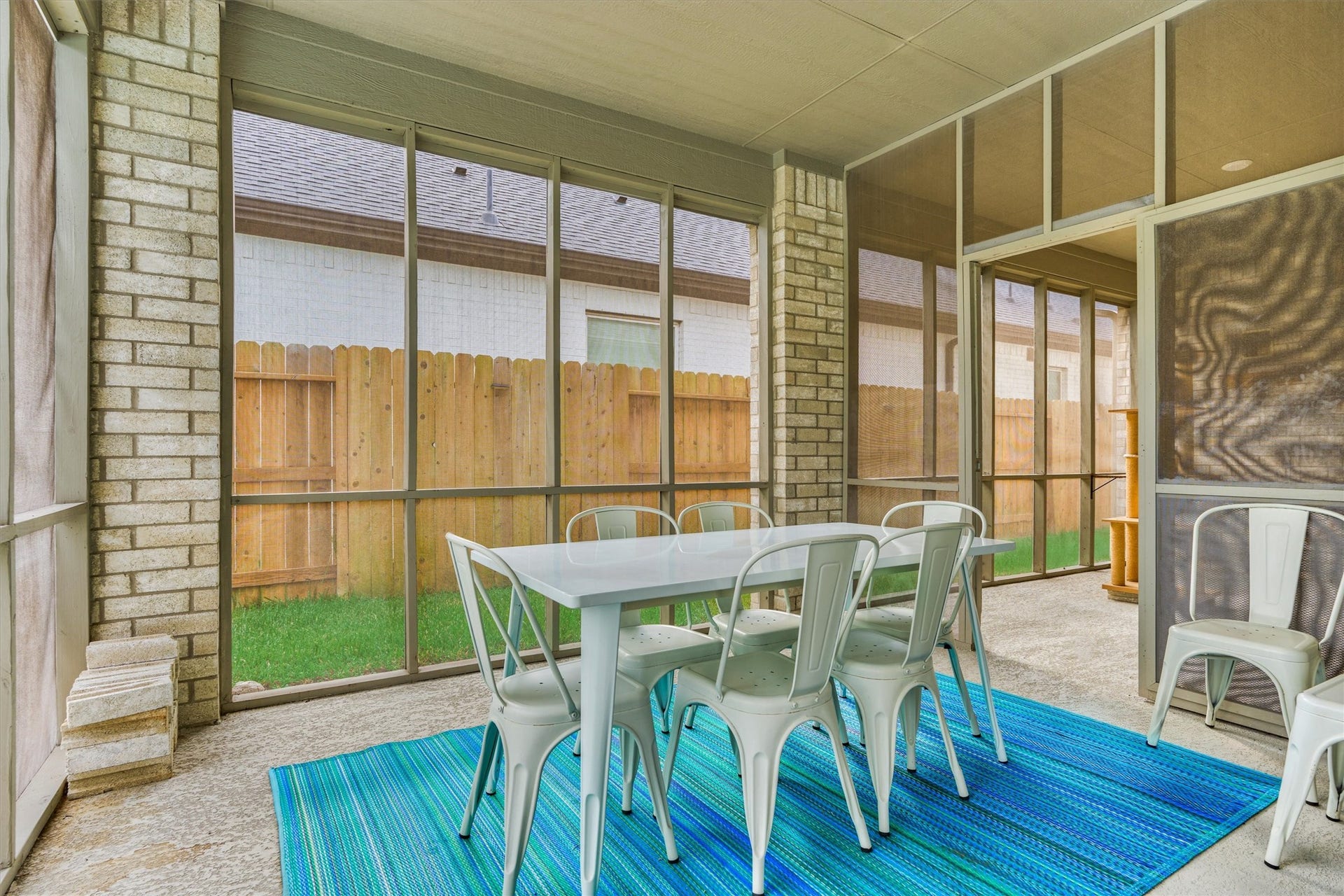The screened side patio will keep the bugs away.