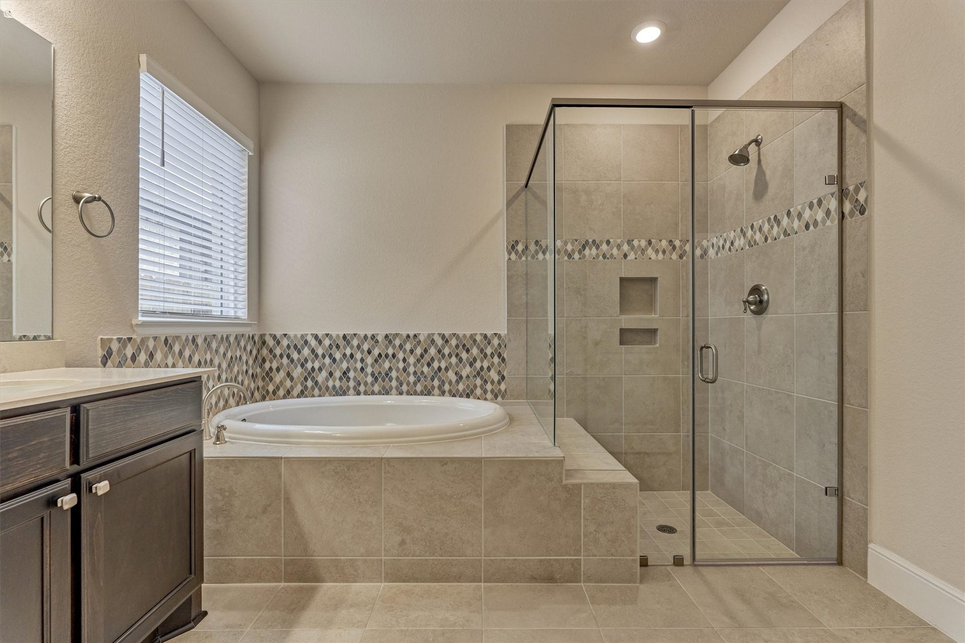 The main bathroom soaker tub and shower.