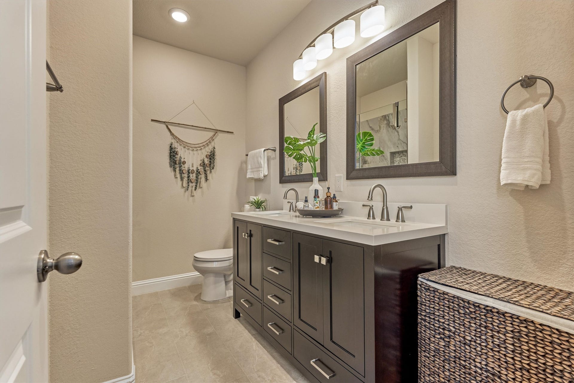 The bathroom connected to the first of the three secondary bedrooms upstairs.