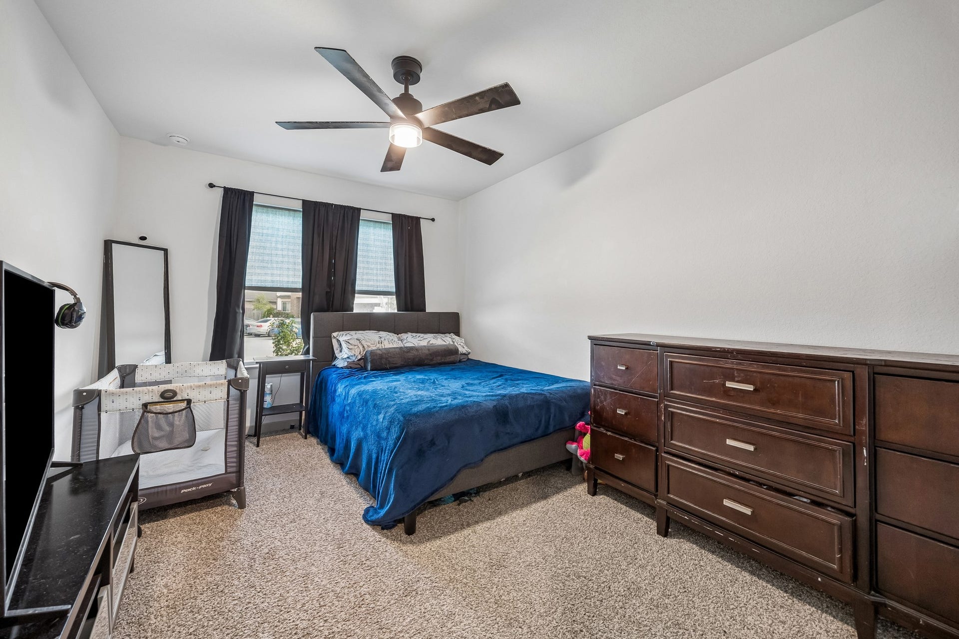 3938 Hordley Terrace Trail, Fulshear, TX 77441 Generously sized secondary bedroom with good natural light and plenty of room for a full bedroom setup.