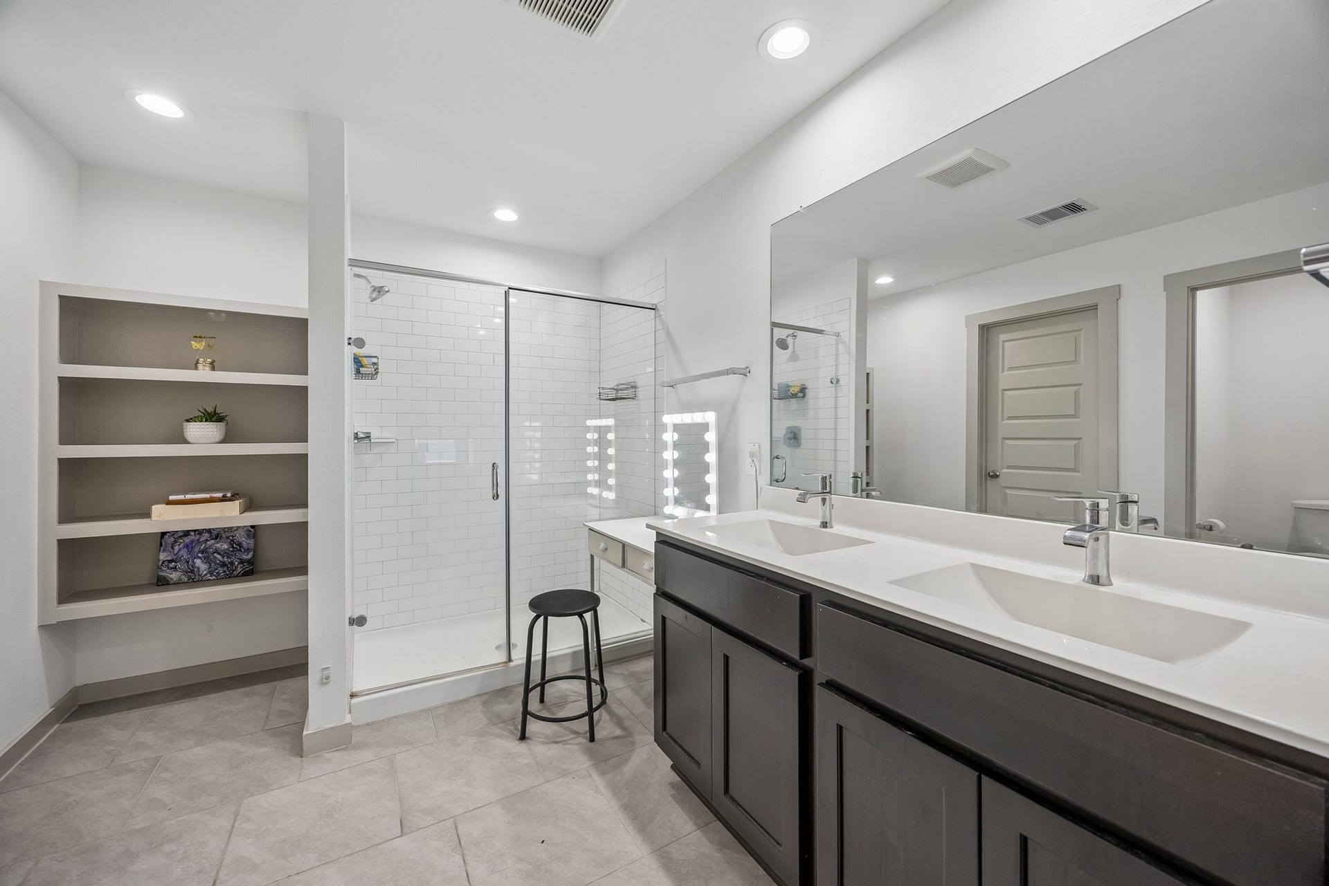 3938 Hordley Terrace Trail, Fulshear, TX 77441 Spacious primary bath with double sinks, a glass-enclosed shower, private water closet, and extra built-in storage, plus a large walk-in closet that adds even more room for everyday organization.