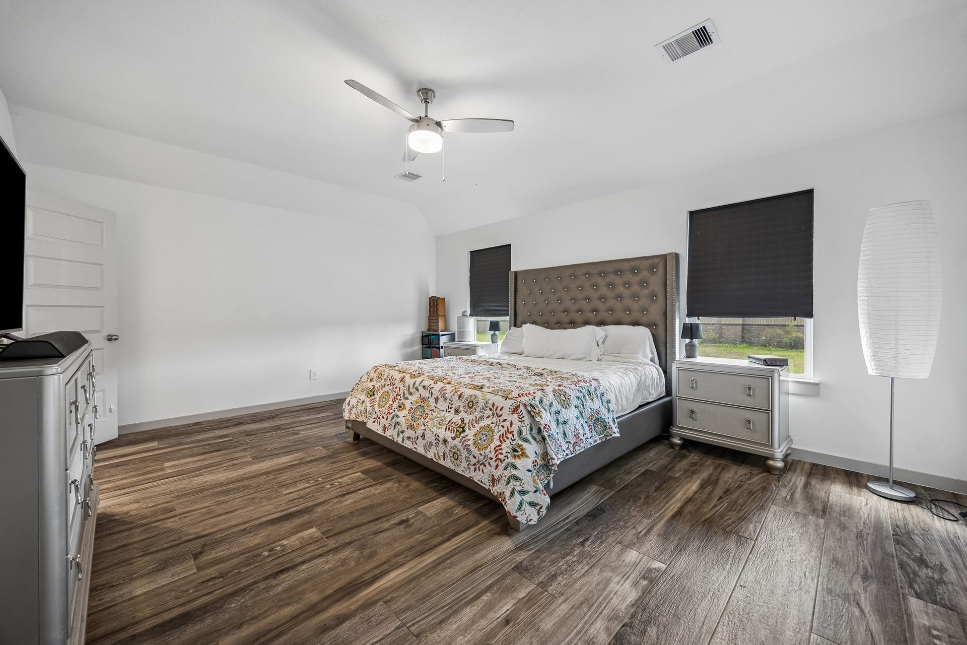 3938 Hordley Terrace Trail, Fulshear, TX 77441 Spacious primary bedroom with a comfortable layout and windows overlooking the backyard, bringing in plenty of natural light.