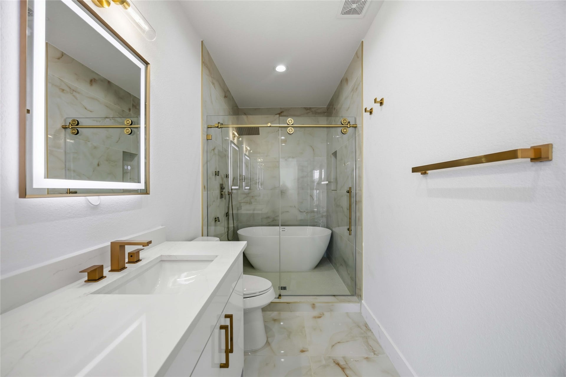 Primary bath features a beautiful wet room