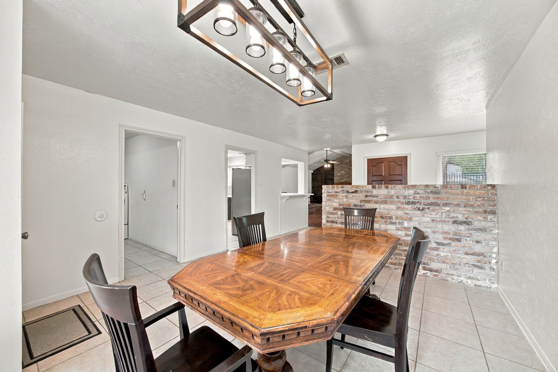 8902 Rocky Lane, Houston, TX 77040 This dining room is large. This eight-person table fits with plenty of seating and space for additional furniture.