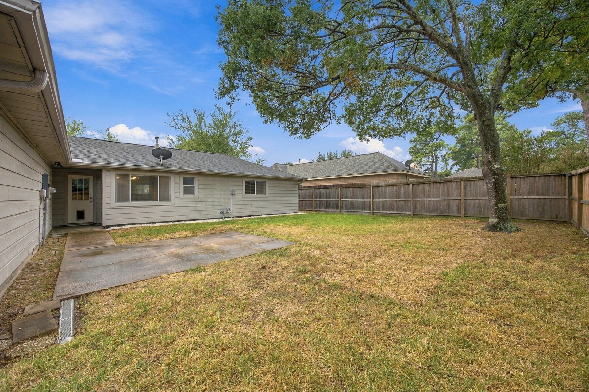 8902 Rocky Lane, Houston, TX 77040 Fully fenced backyard for privacy and to keep the pets contained.