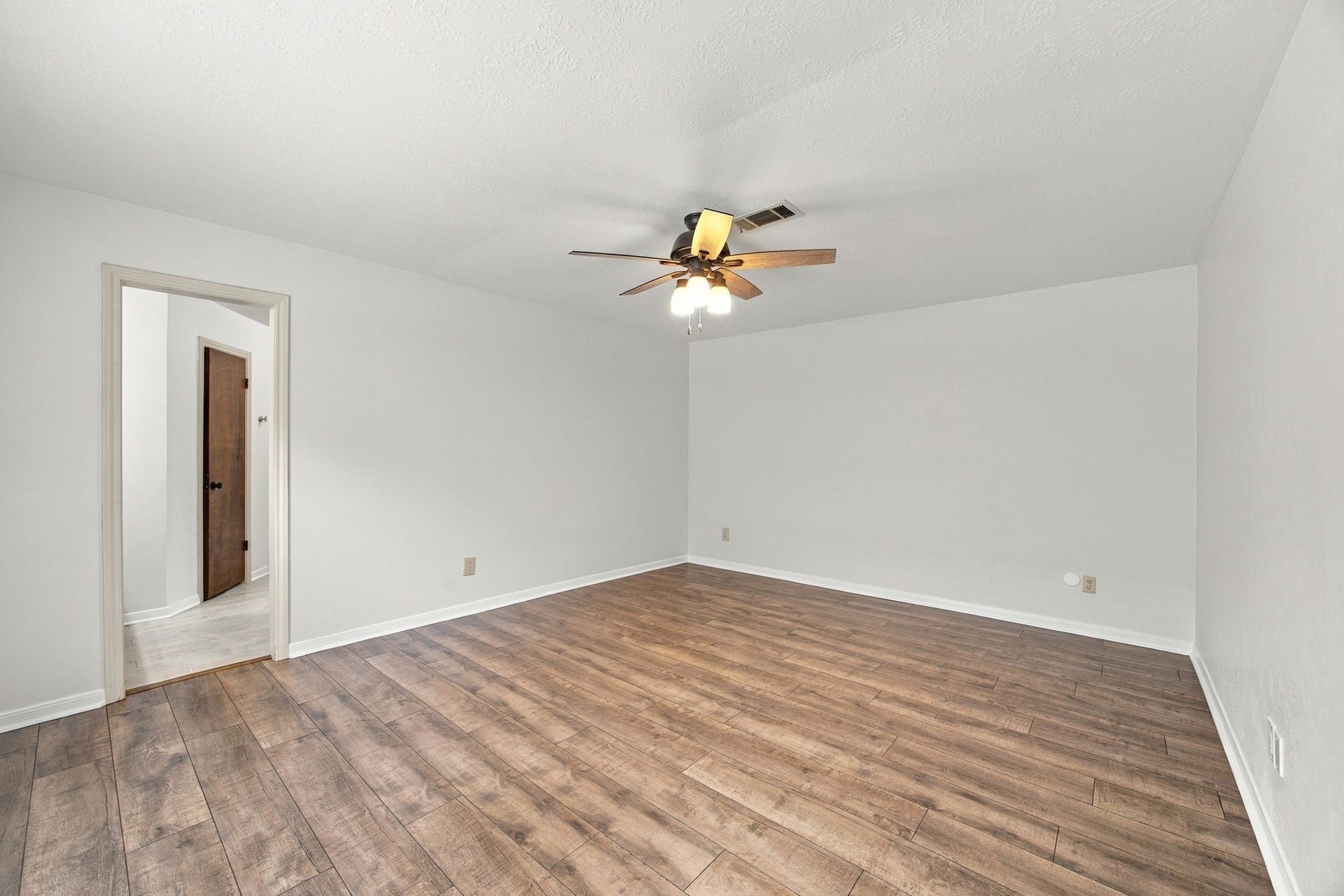 8902 Rocky Lane, Houston, TX 77040 The primary bedroom is a good size. New flooring and no carpet for easy maintenance.