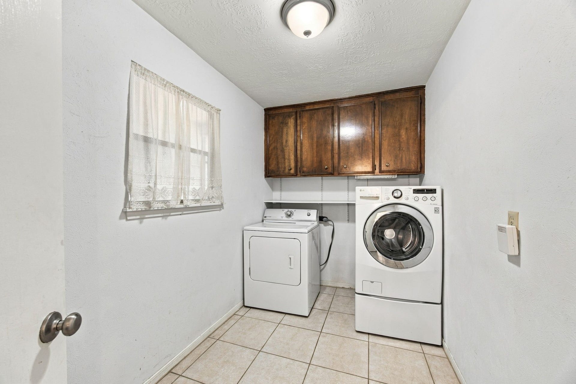8902 Rocky Lane, Houston, TX 77040 The laundry room in the back of the home. It is a large space and could be great storage.