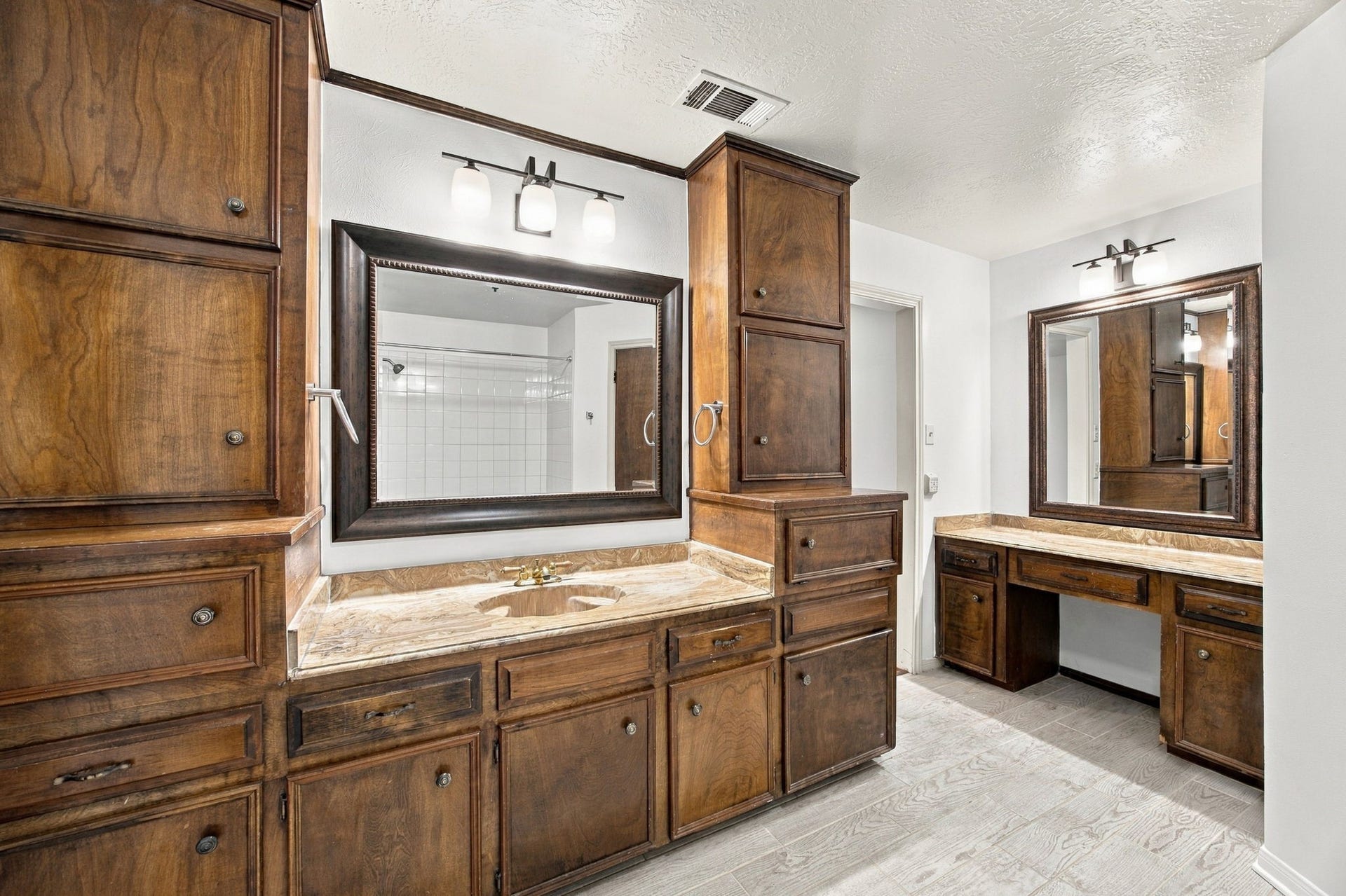 8902 Rocky Lane, Houston, TX 77040 Primary bathroom has more cabinets than some kitchens... Plenty of room for everyone to get ready in the morning.
