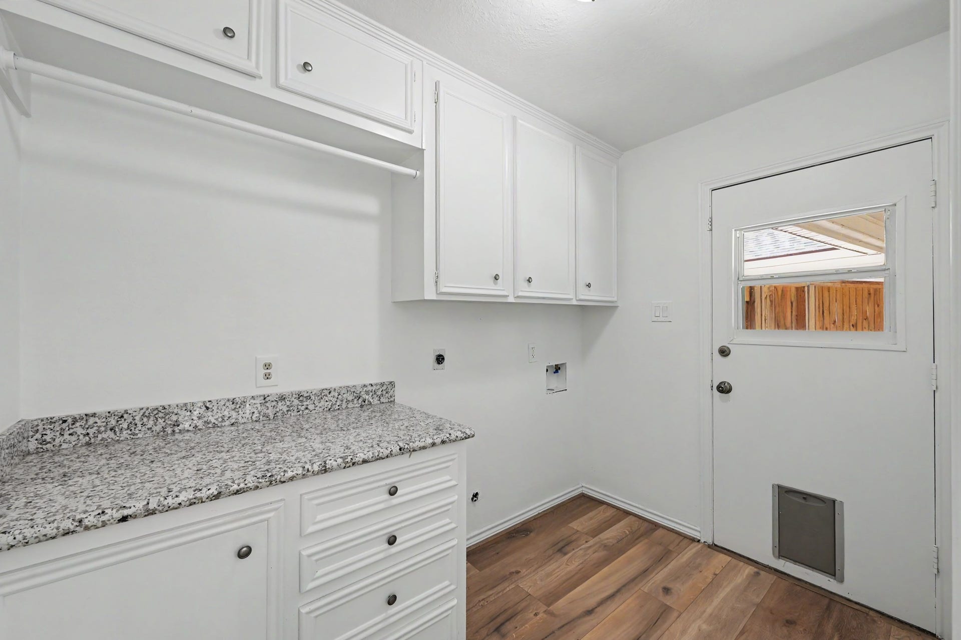 19 Postvine Court, The Woodlands, TX 77381 Utility room with extra storage .