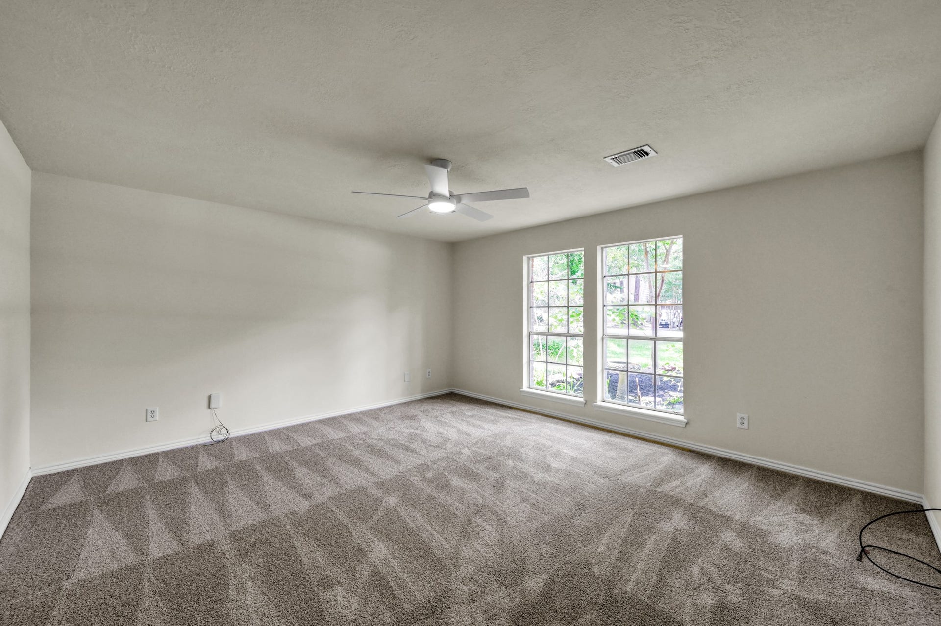 19 Postvine Court, The Woodlands, TX 77381 Primary bedroom offers a peaceful oasis.