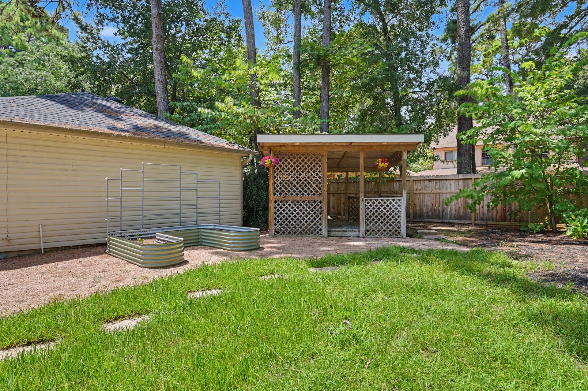 19 Postvine Court, The Woodlands, TX 77381 Raised garden & gazebo.
