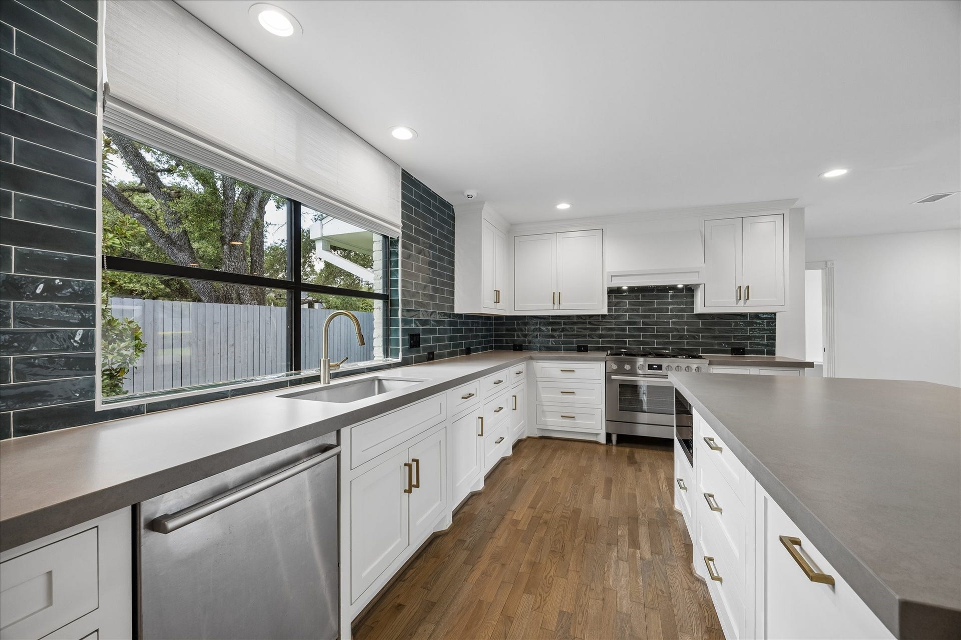 Upscale stainless steel appliances and abundant storage with soft-close cabinetry and drawers complete this beautifully appointed kitchen.