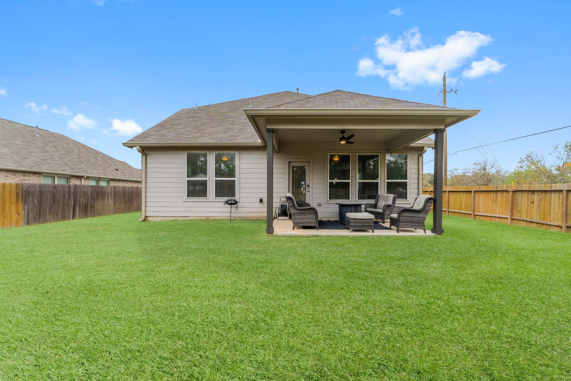 7054 Terra Drive, Manvel, TX 77578 Expansive backyard providing privacy and open green space.