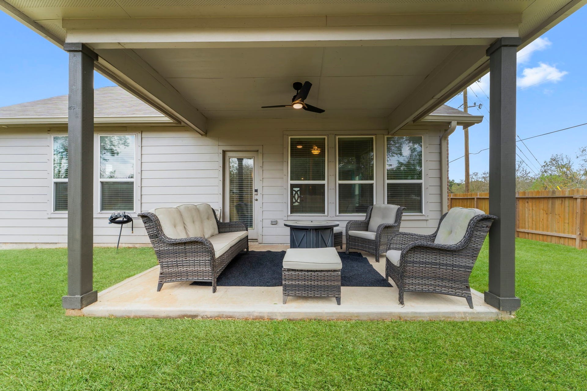 7054 Terra Drive, Manvel, TX 77578 Relaxing outdoor living area ideal for entertaining year-round.