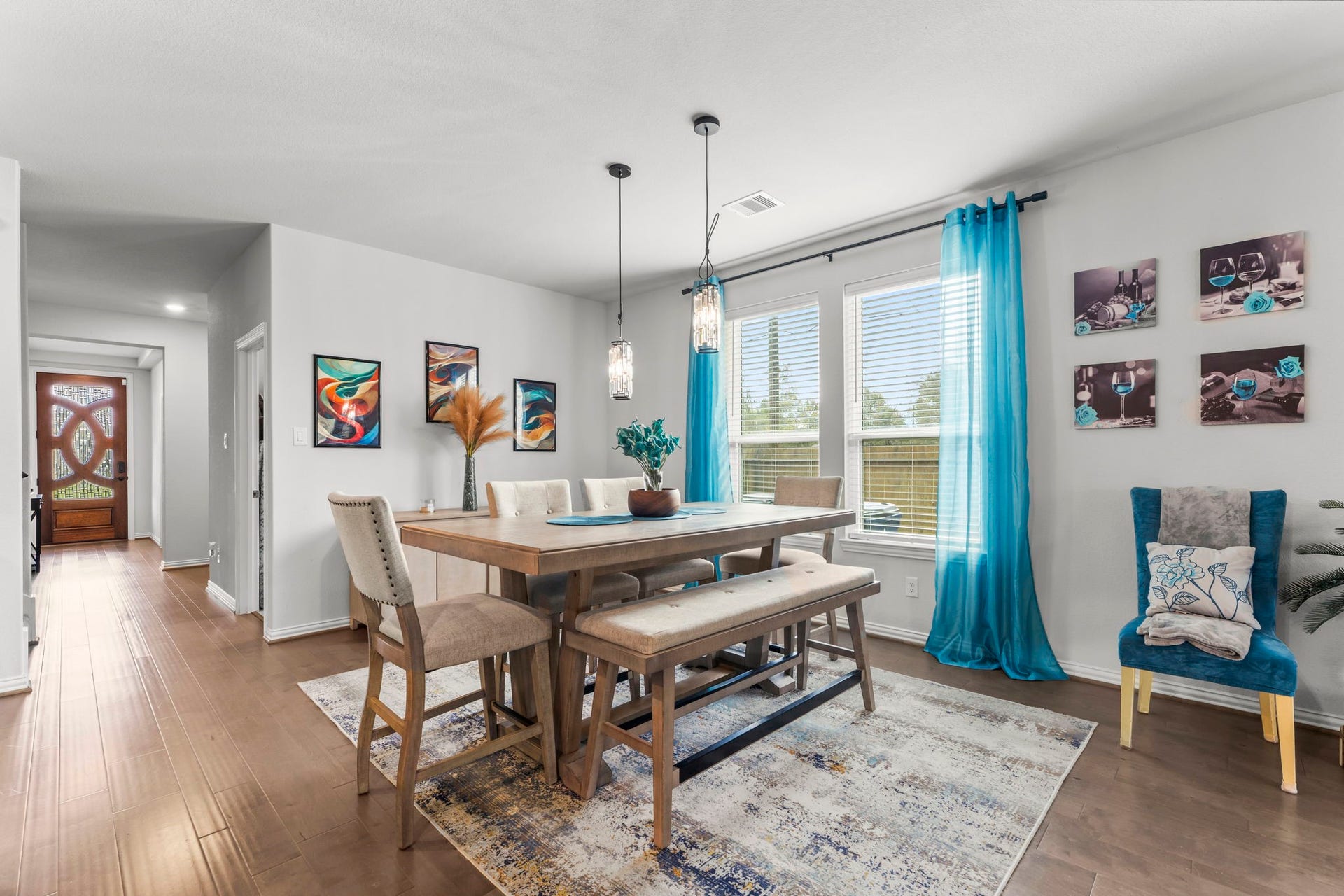 7054 Terra Drive, Manvel, TX 77578 Spacious dining area with modern lighting and large windows overlooking the yard.