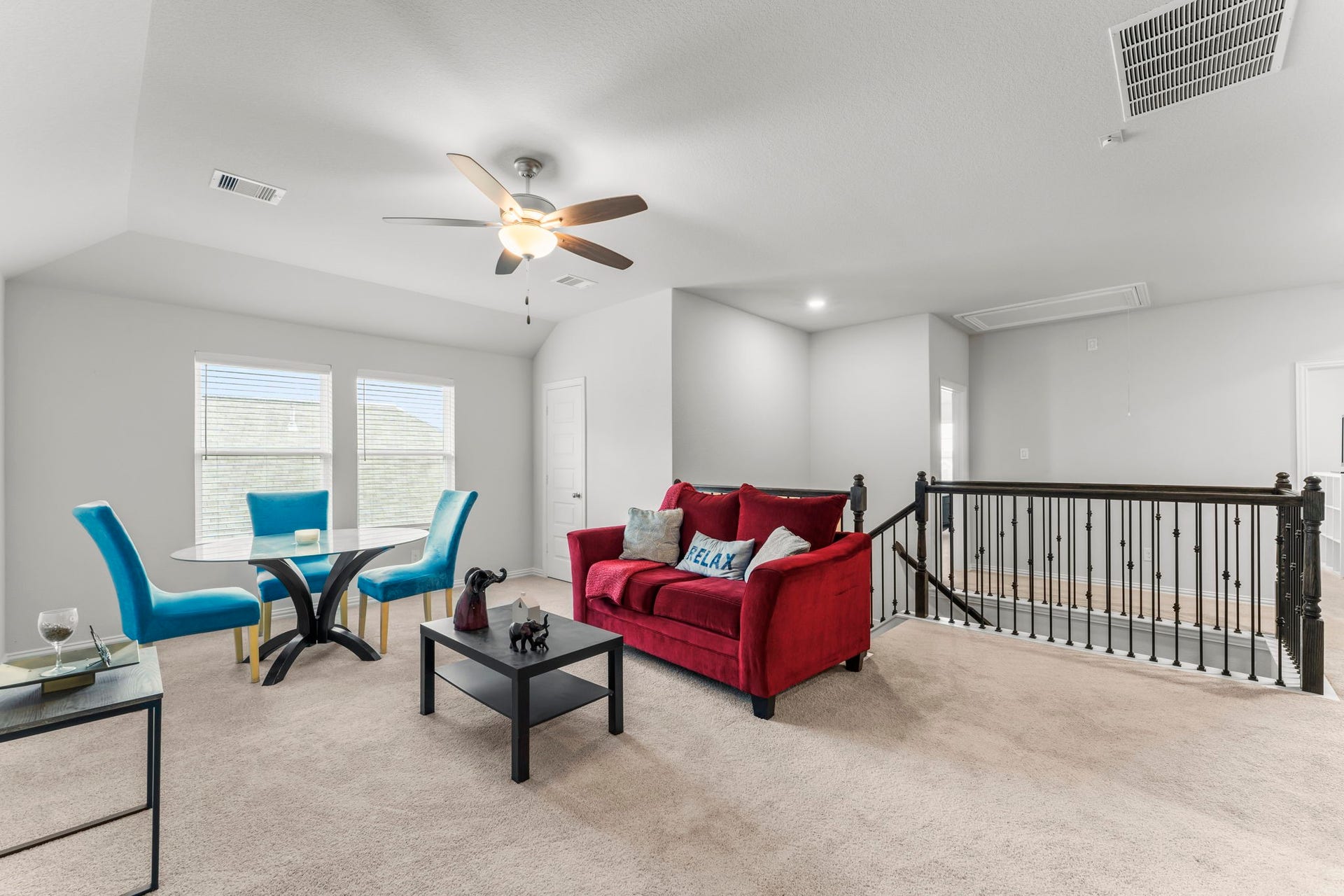 7054 Terra Drive, Manvel, TX 77578 Bright second-floor living space with room for seating and activities.