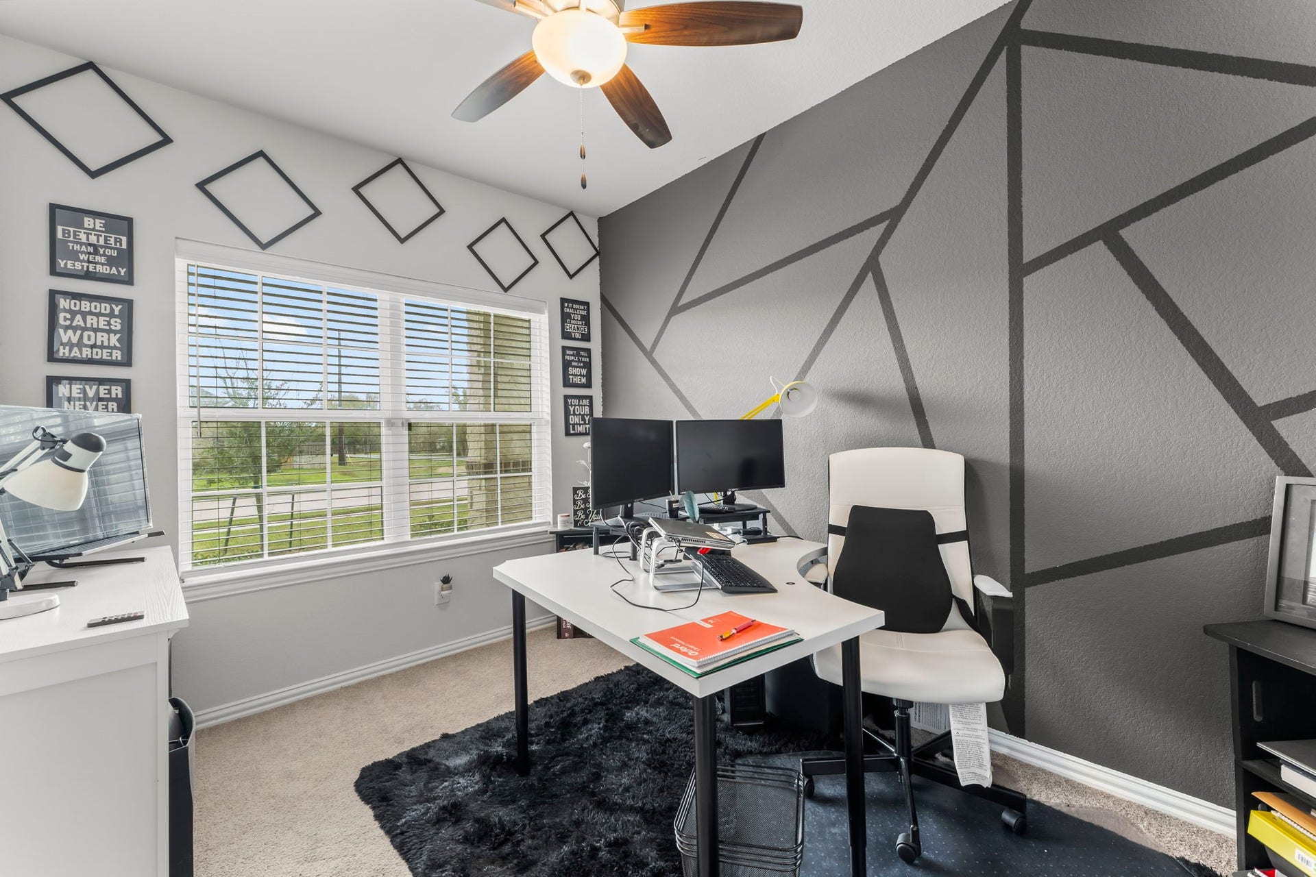 7054 Terra Drive, Manvel, TX 77578 Dedicated home office with large windows and stylish accent wallperfect for working or studying from home.