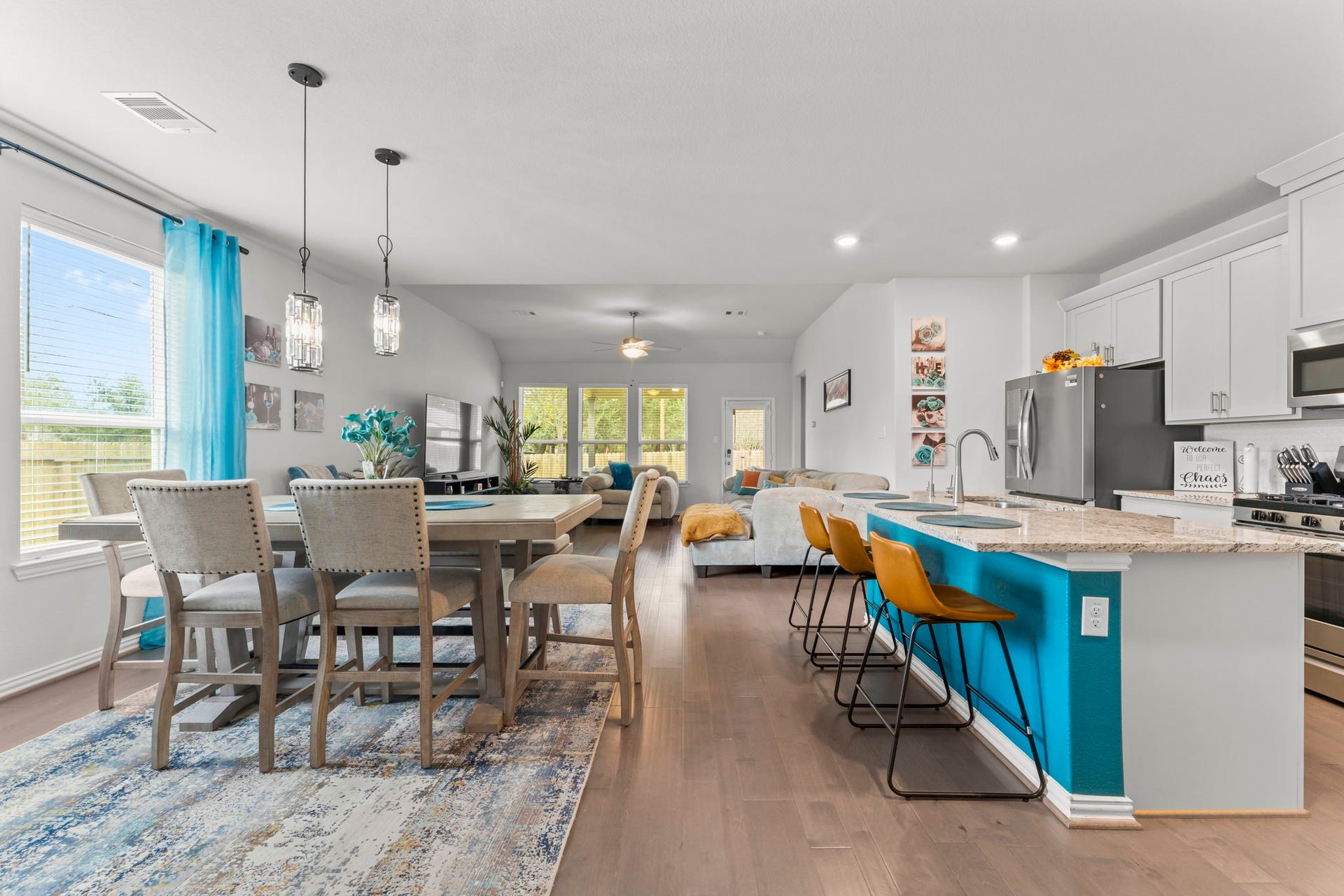 7054 Terra Drive, Manvel, TX 77578 Kitchen island with breakfast bar seating opens beautifully to the dining area.