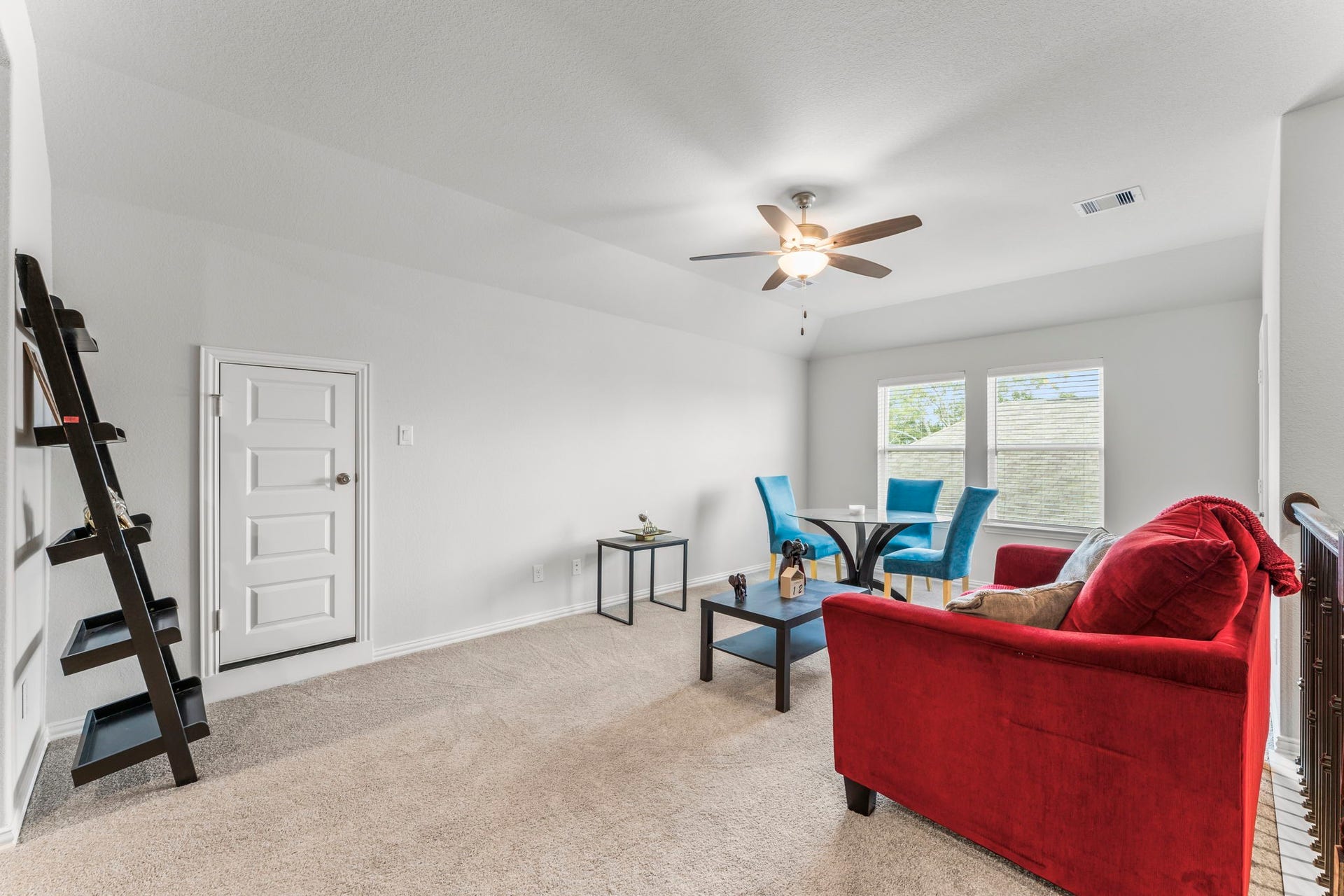7054 Terra Drive, Manvel, TX 77578 Versatile upstairs game room perfect for lounging, studying, or play.