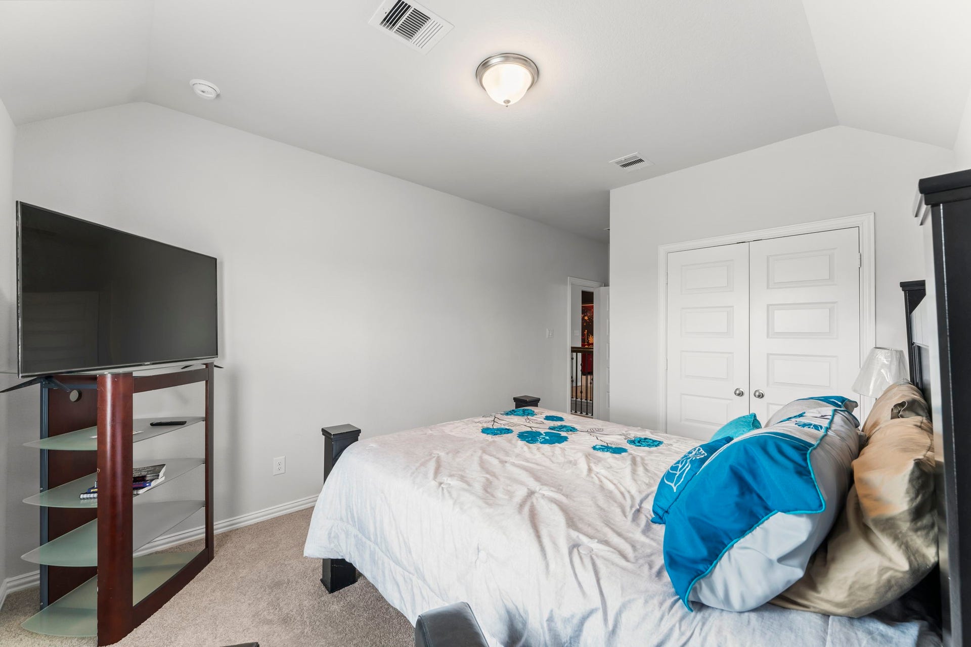 7054 Terra Drive, Manvel, TX 77578 Comfortable secondary bedroom with large window and closet.