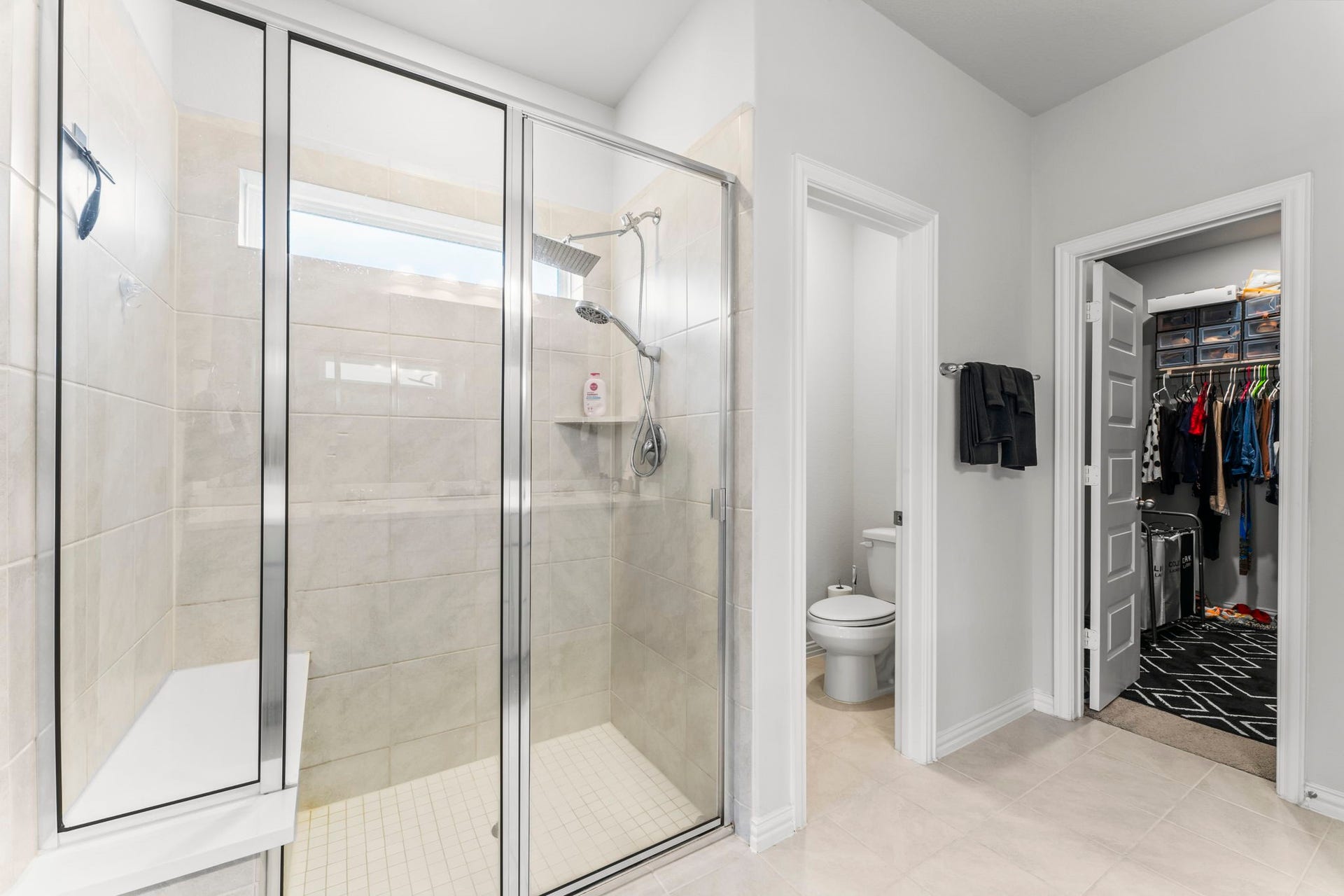 7054 Terra Drive, Manvel, TX 77578 Walk-in shower and direct access to a generous walk-in closet.