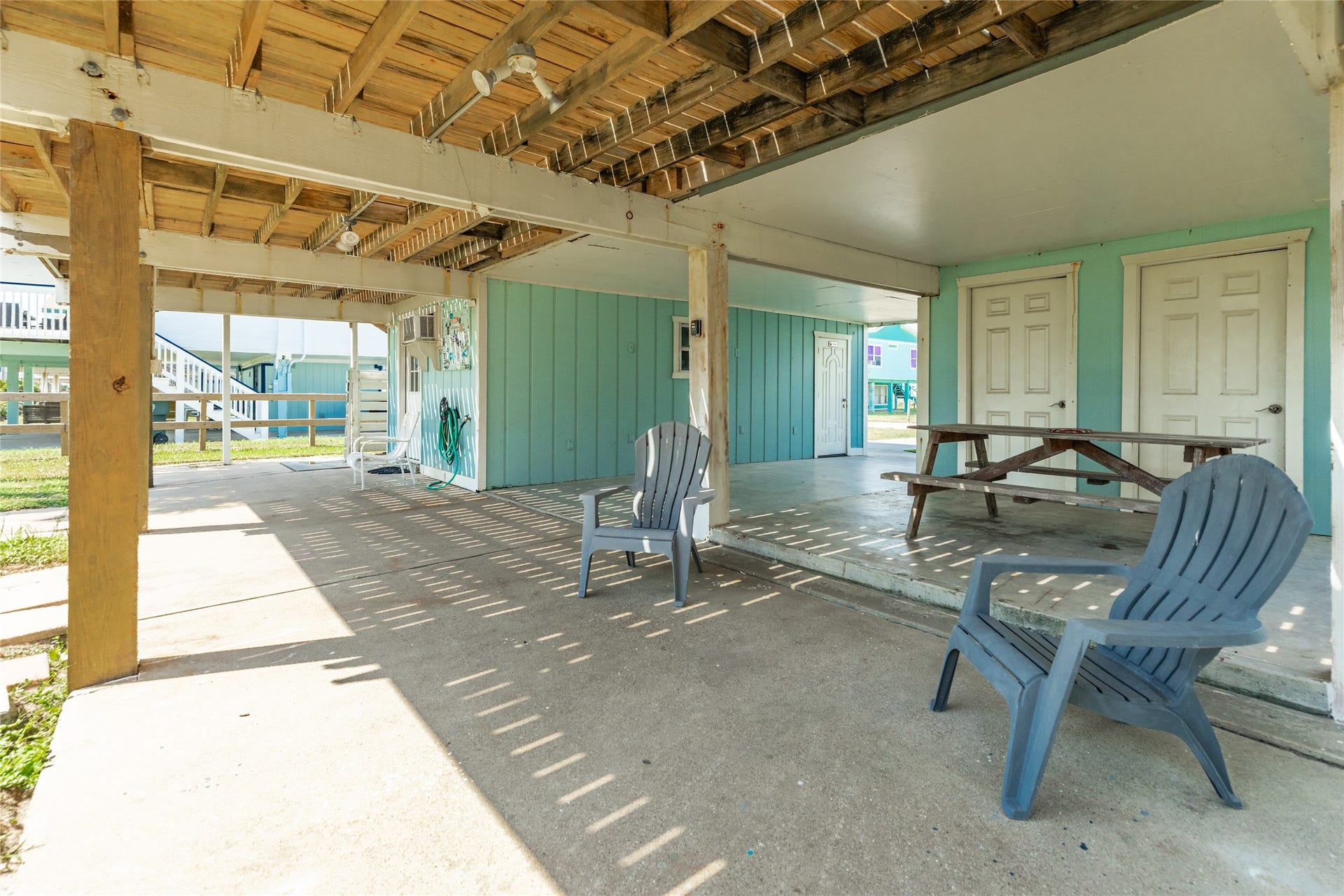 13103 John Reynolds Road, Galveston, TX 77554 Ground level shaded area for enjoying gulf breezes, naps and day on the hammock.