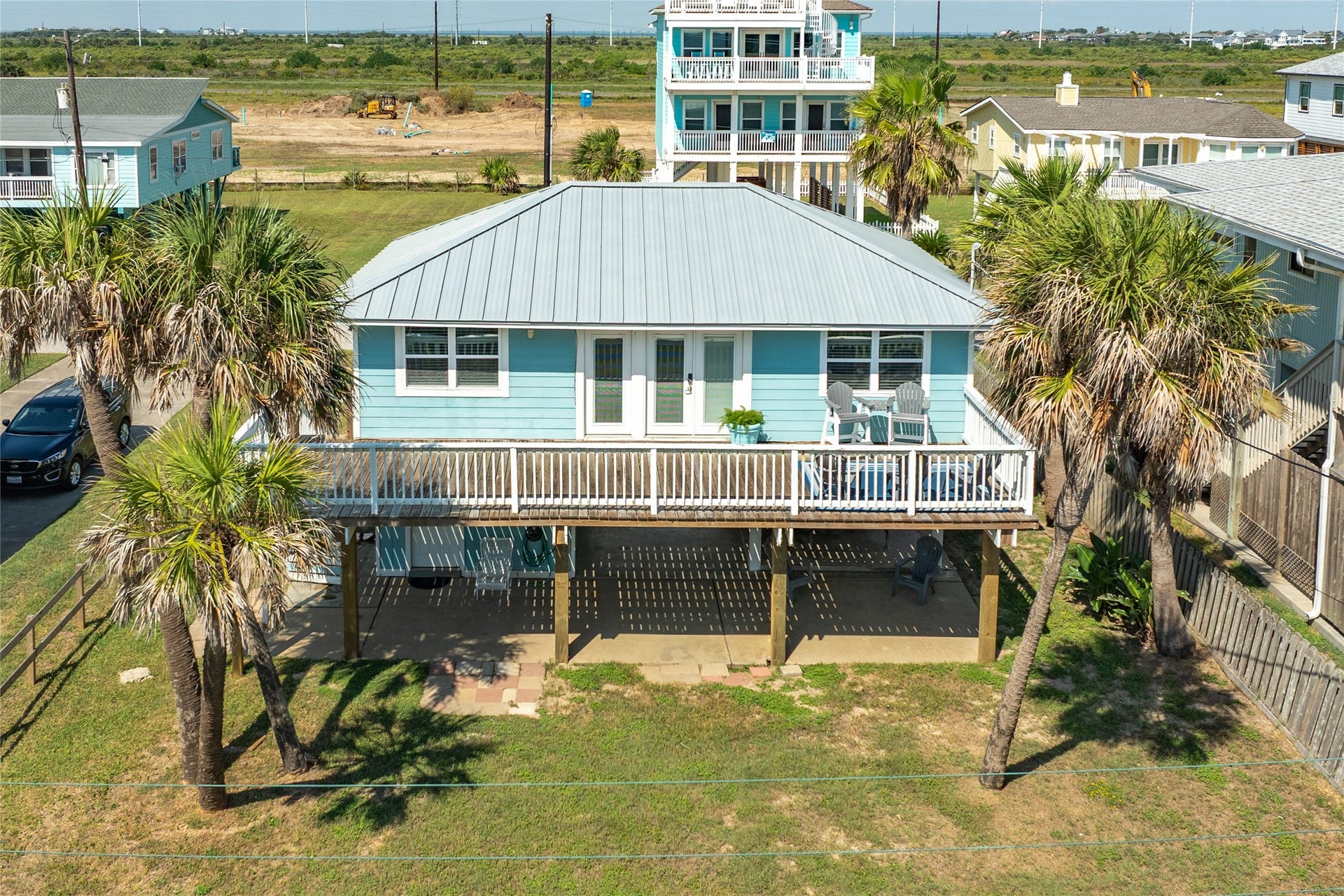 13103 John Reynolds Road, Galveston, TX 77554 Back of home with inviting deck to enjoy morning coffee.