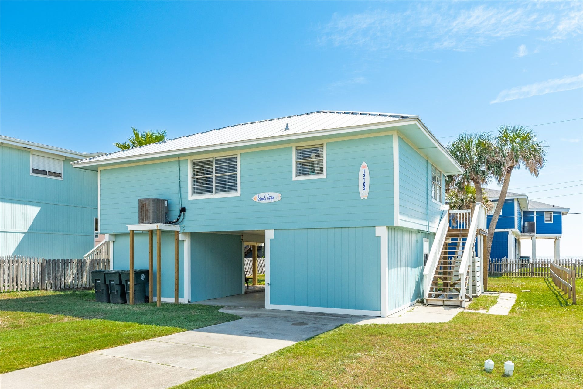 13103 John Reynolds Road, Galveston, TX 77554 Front of home with hardi plank exterior and metal roof.