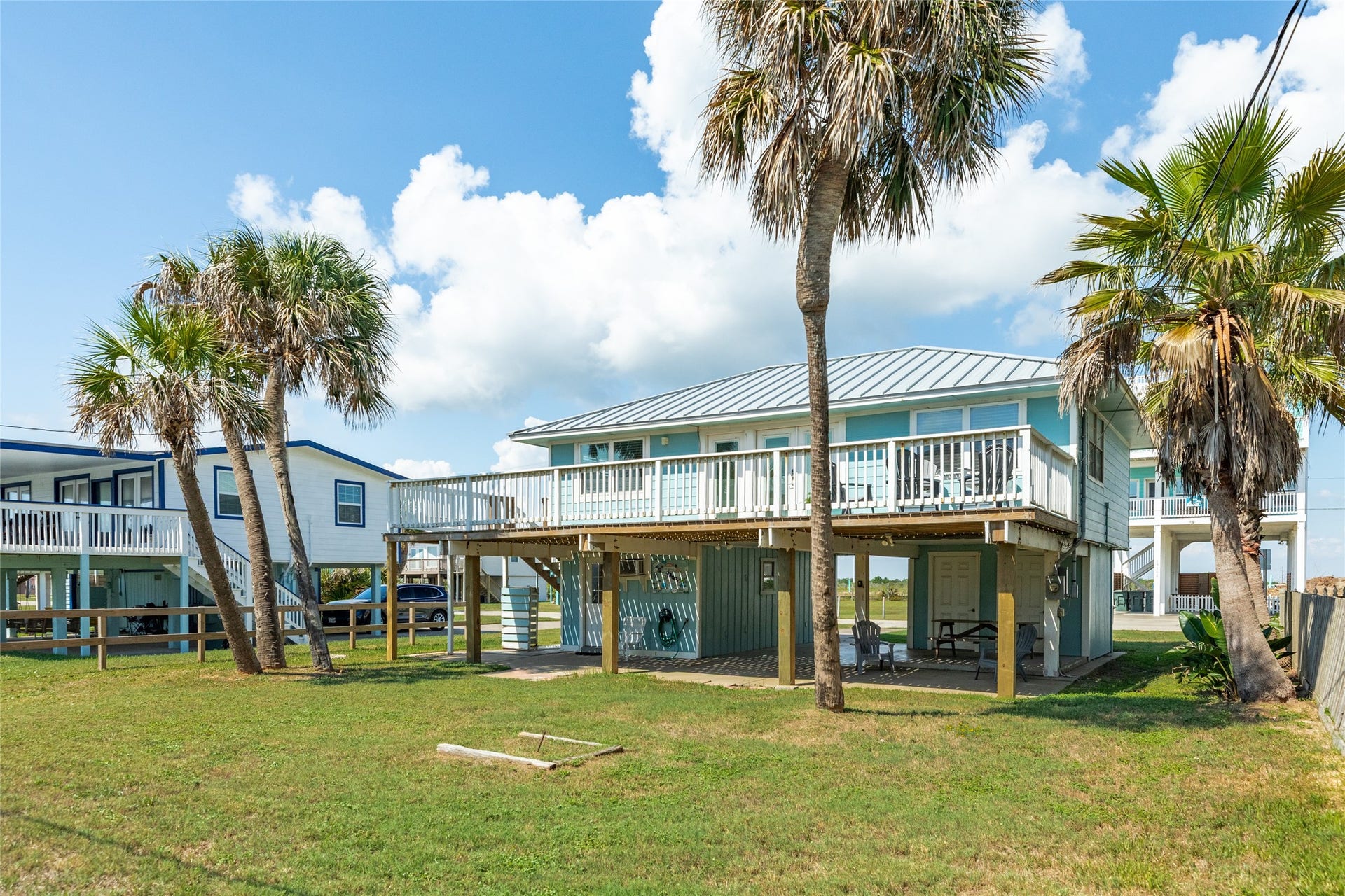 13103 John Reynolds Road, Galveston, TX 77554 Back of home with covered porch with access to ground level bedroom.