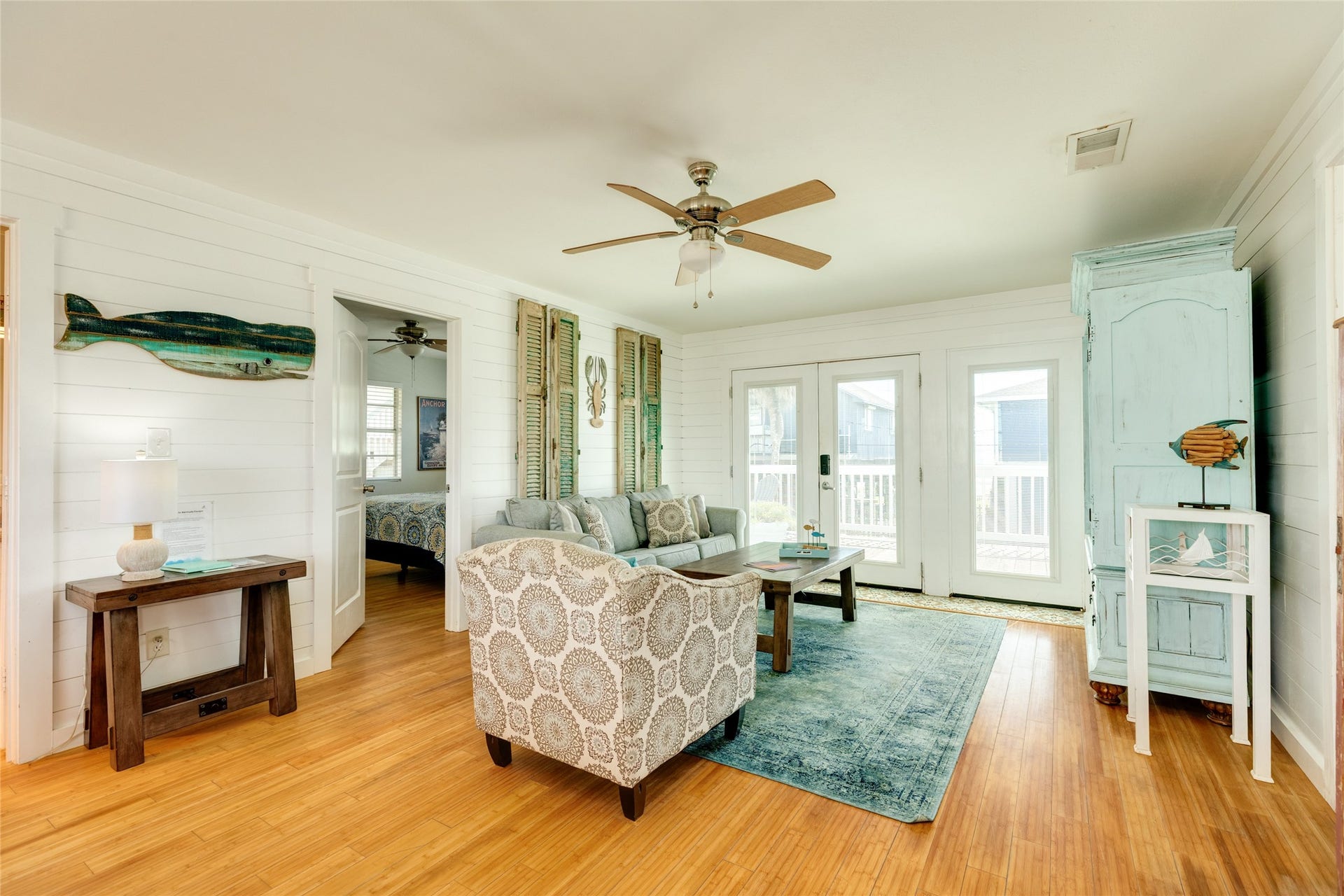 13103 John Reynolds Road, Galveston, TX 77554 Front entrance into the living space with coastal chic decor, ship lap walls and relaxing coastal vibe while enjoying views of the Gulf.