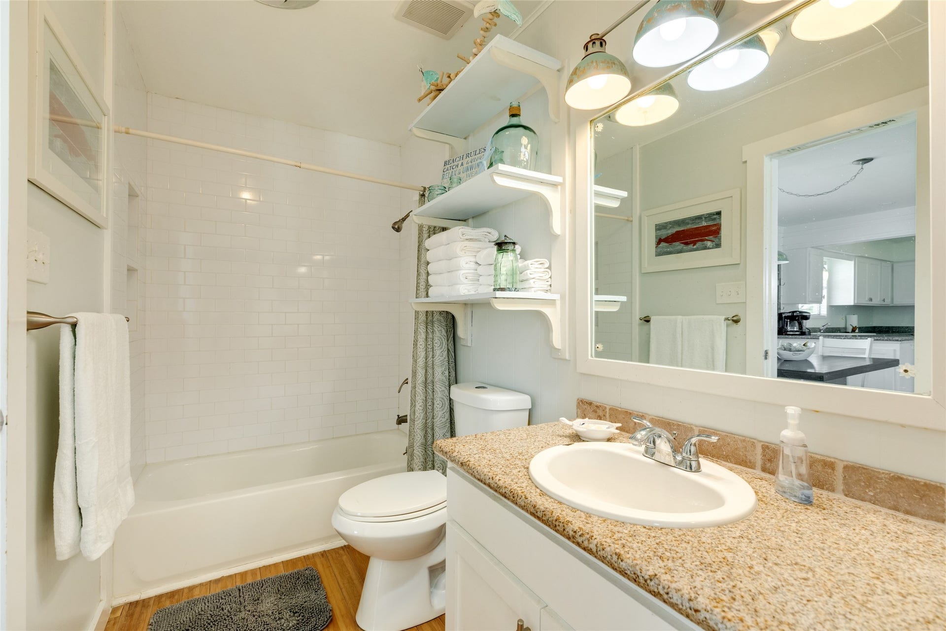 13103 John Reynolds Road, Galveston, TX 77554 Secondary bathroom with decorative tile and granite counters.