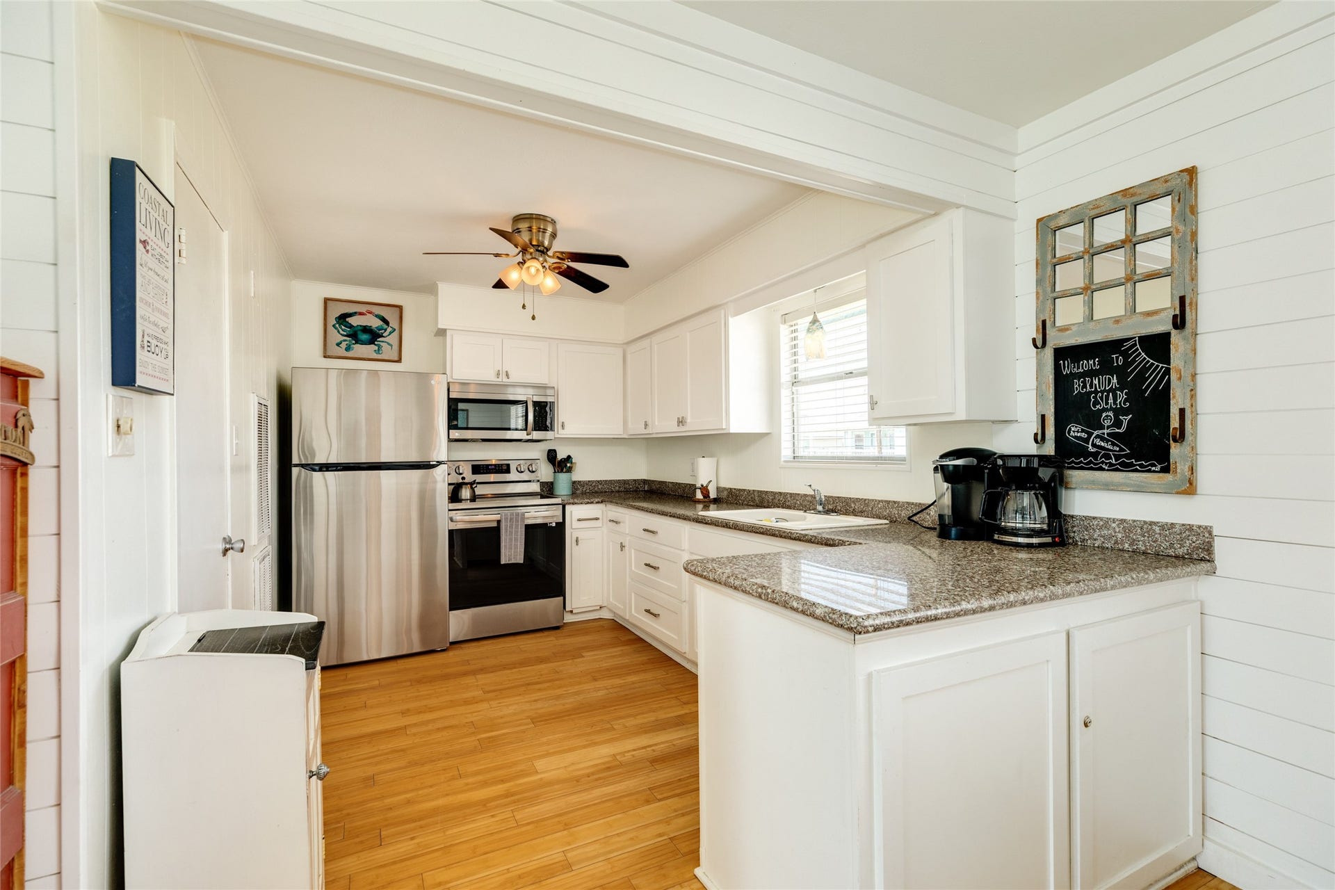 13103 John Reynolds Road, Galveston, TX 77554 Kitchen with stainless appliances and granite counters.