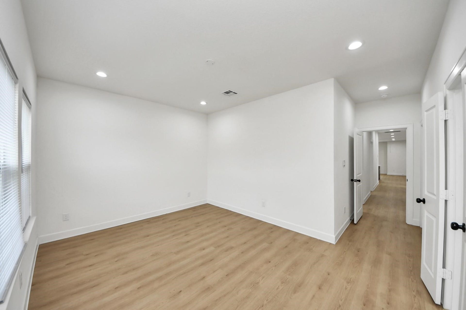 8316 Corinth Street, #c, Houston, TX 77051 The spacious primary suite features recessed lighting, vinyl plank flooring, and a modern neutral palette.