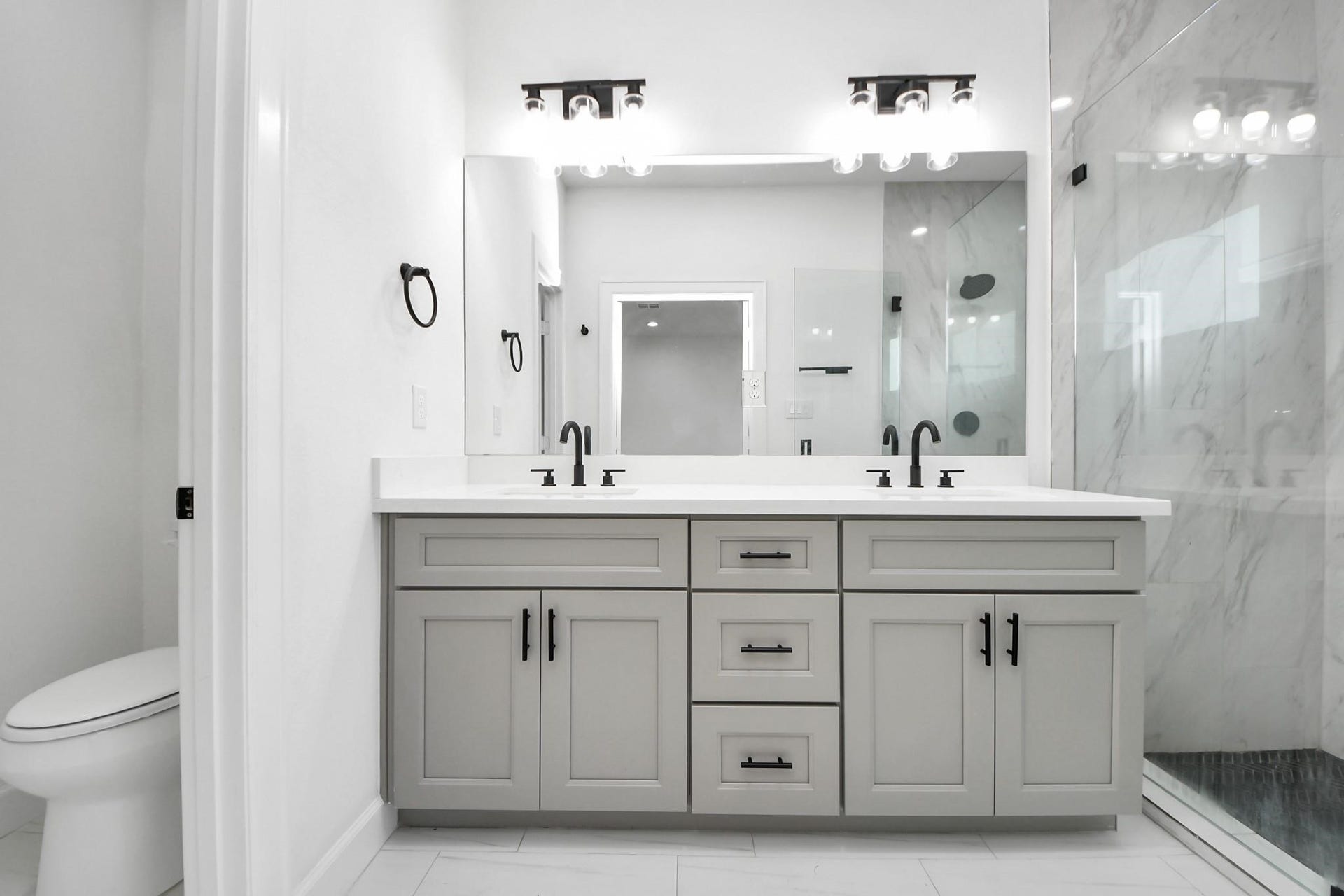8316 Corinth Street, #c, Houston, TX 77051 Double vanities with quartz counters and undermount sinks provide both elegance and efficiency.
