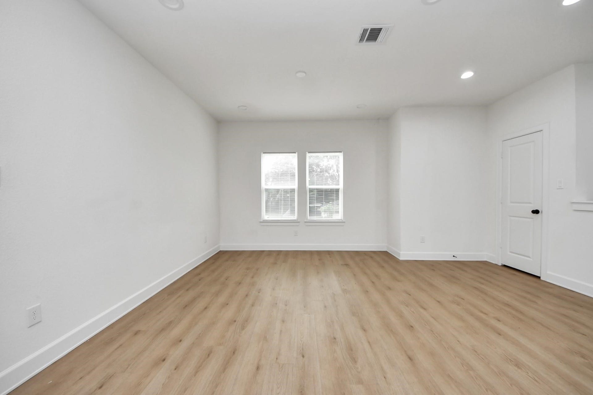 8316 Corinth Street, #c, Houston, TX 77051 The living areas large windows invite in soft natural light and elevate the rooms clean aesthetic.