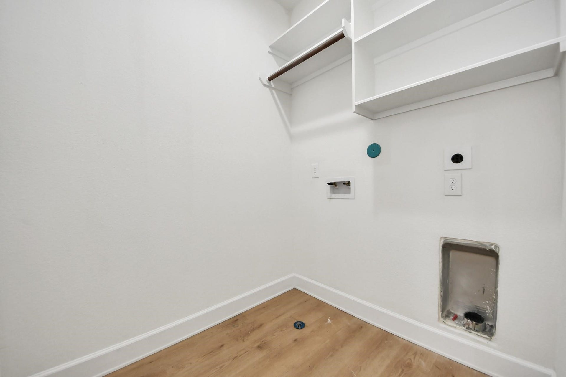 8316 Corinth Street, #c, Houston, TX 77051 Dedicated utility room includes full-size washer and dryer connections with overhead shelving for easy organization.