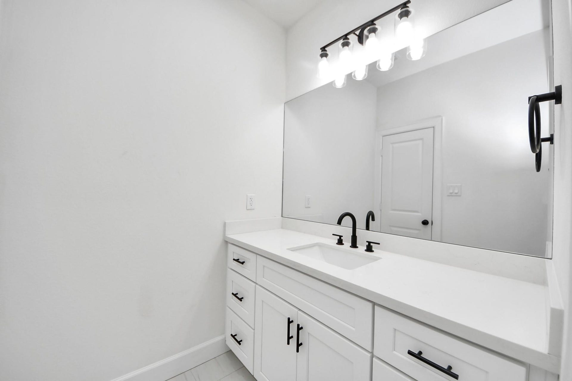 8316 Corinth Street, #c, Houston, TX 77051 The quartz countertop and undermount sink provide a seamless, easy-to-clean surface in this secondary bathroom.
