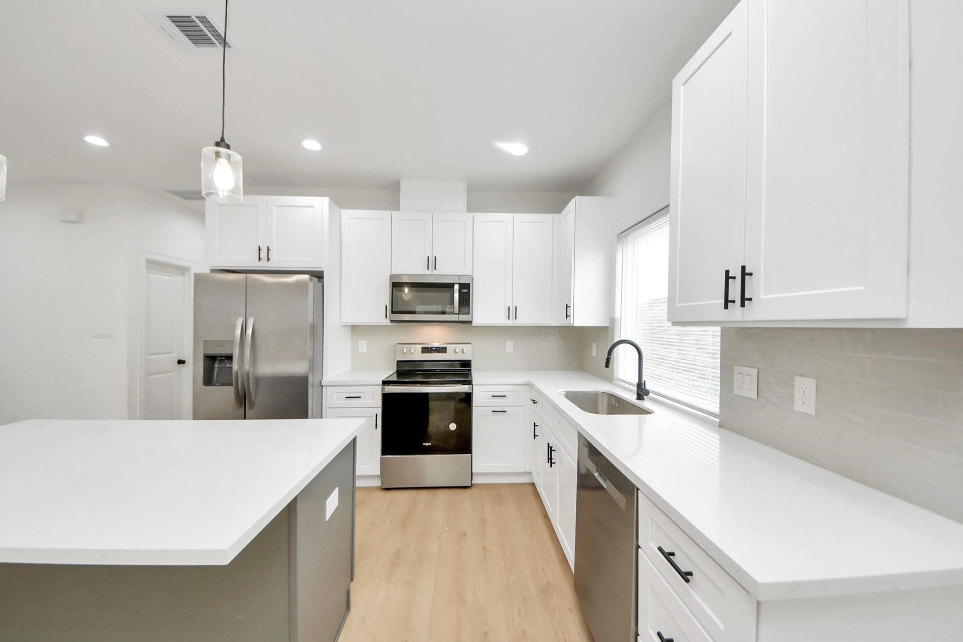8316 Corinth Street, #c, Houston, TX 77051 A large window brings natural light into the heart of the homes open-concept layout.