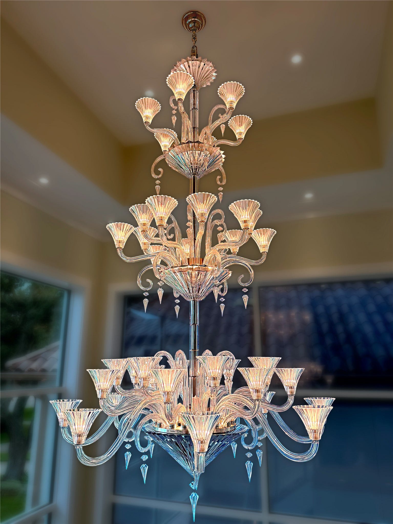 An exquisite decorative chandelier highlights the home's attention to artistry and interior craftsmanship. The sculptural fixture complements the residence's curated collection of Italian furnishings and distinctive architectural details.