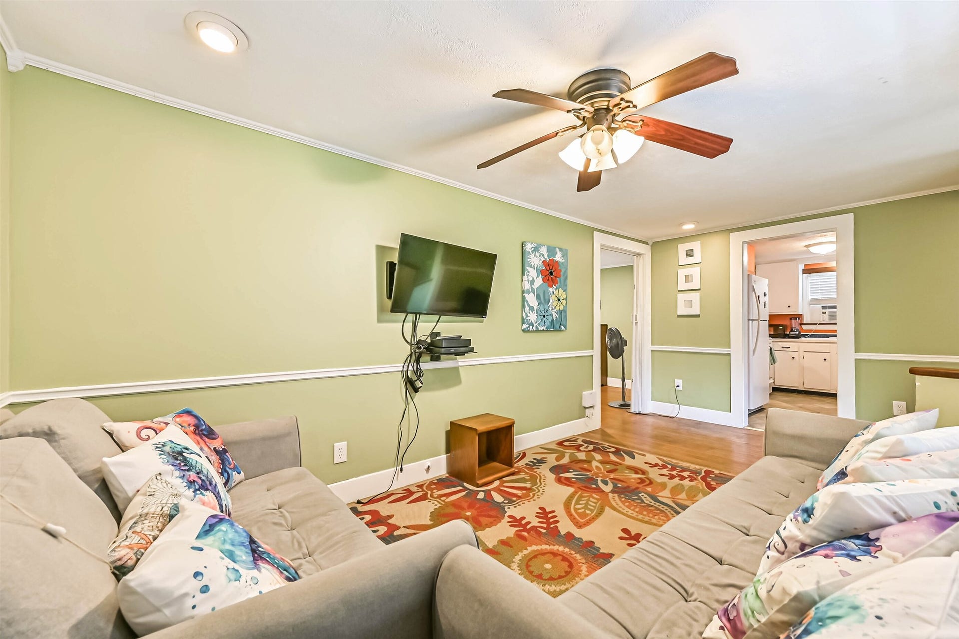 A cozy living room with soft seating and warm decorative touches, perfect for relaxing at the end of the day.