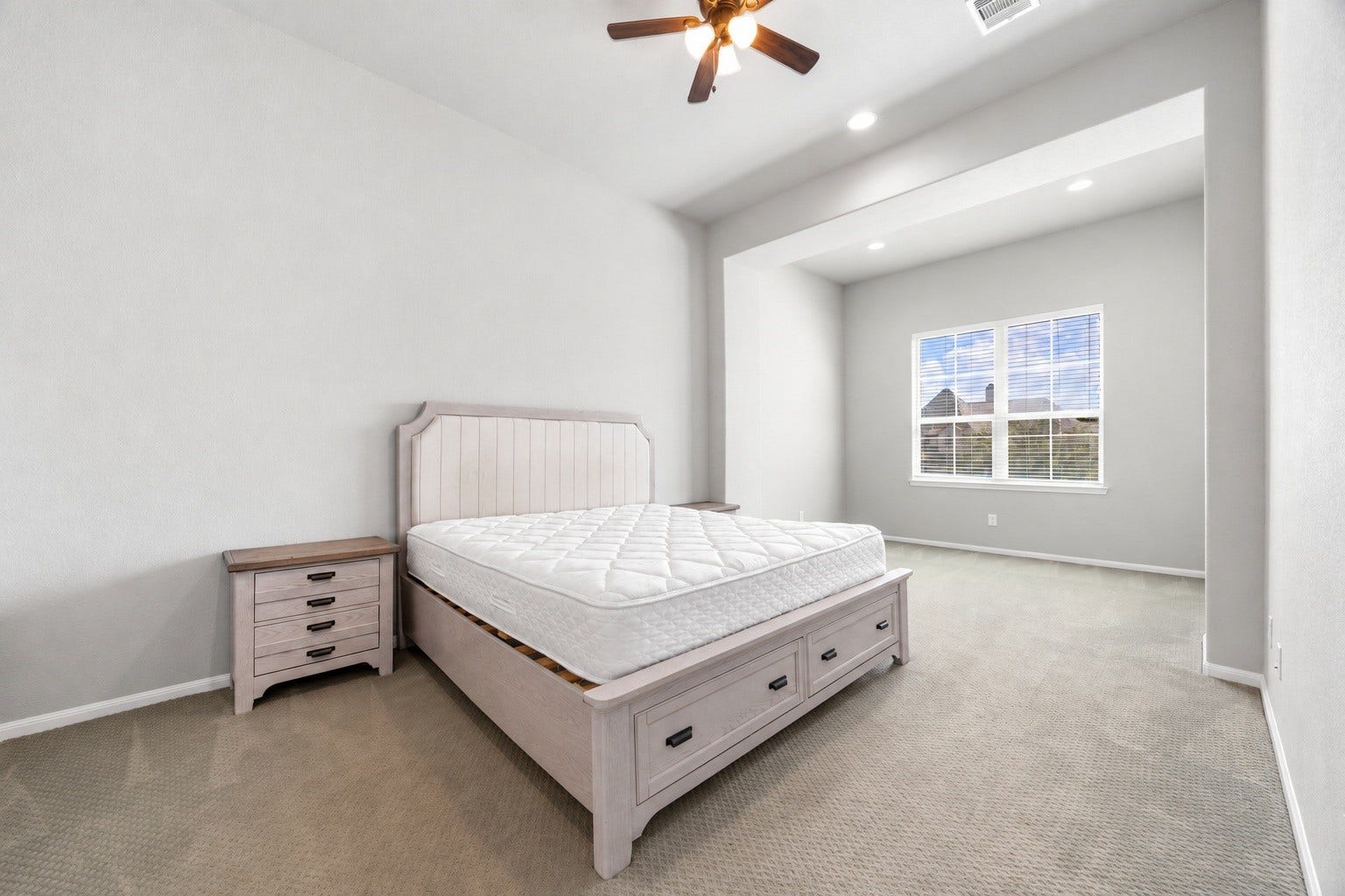 10606 Comeaux Lane, Richmond, TX 77407 The home's second primary suite offers an expansive footprint with a large windowed sitting area, giving this upstairs retreat flexibility as a private suite or secondary living space.