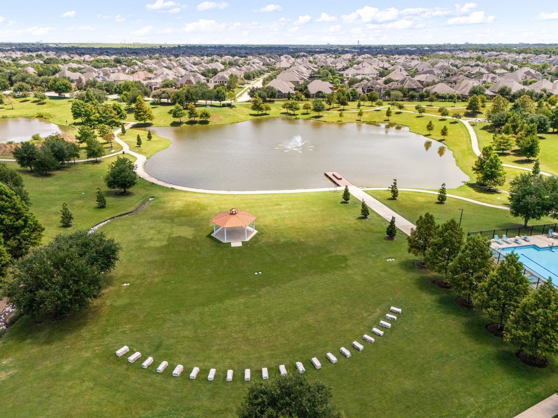 10606 Comeaux Lane, Richmond, TX 77407 A sweeping aerial perspective showcases the scale of Aliana, where thoughtfully designed residential enclaves surround inviting community gathering spaces. The neighborhoods expansive layout offers a sense of openness while remaining connected to the amenities that make Aliana such a sought-after Richmond community.