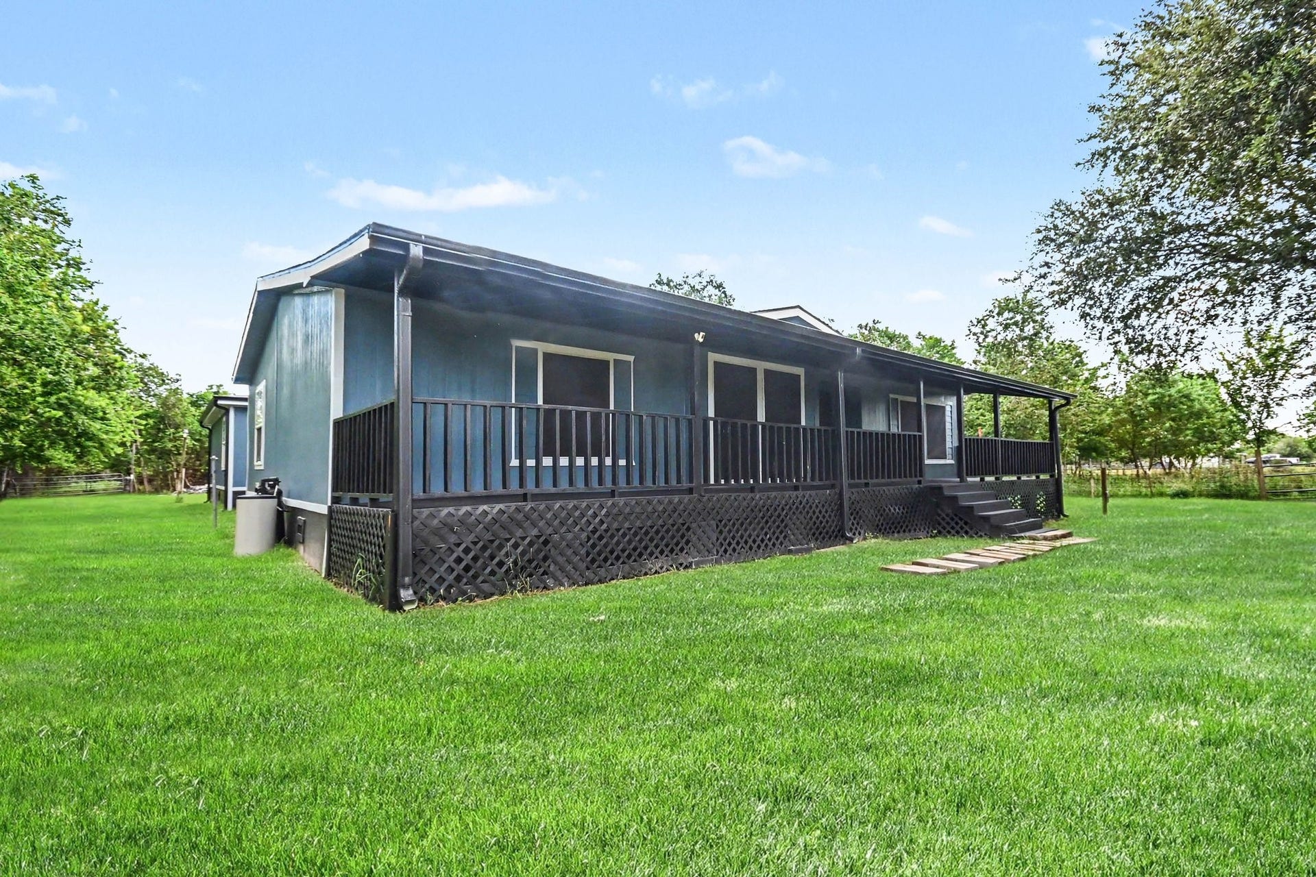 2925 FM 2917, Alvin, TX 77511 Front porch expands the entire length of home
