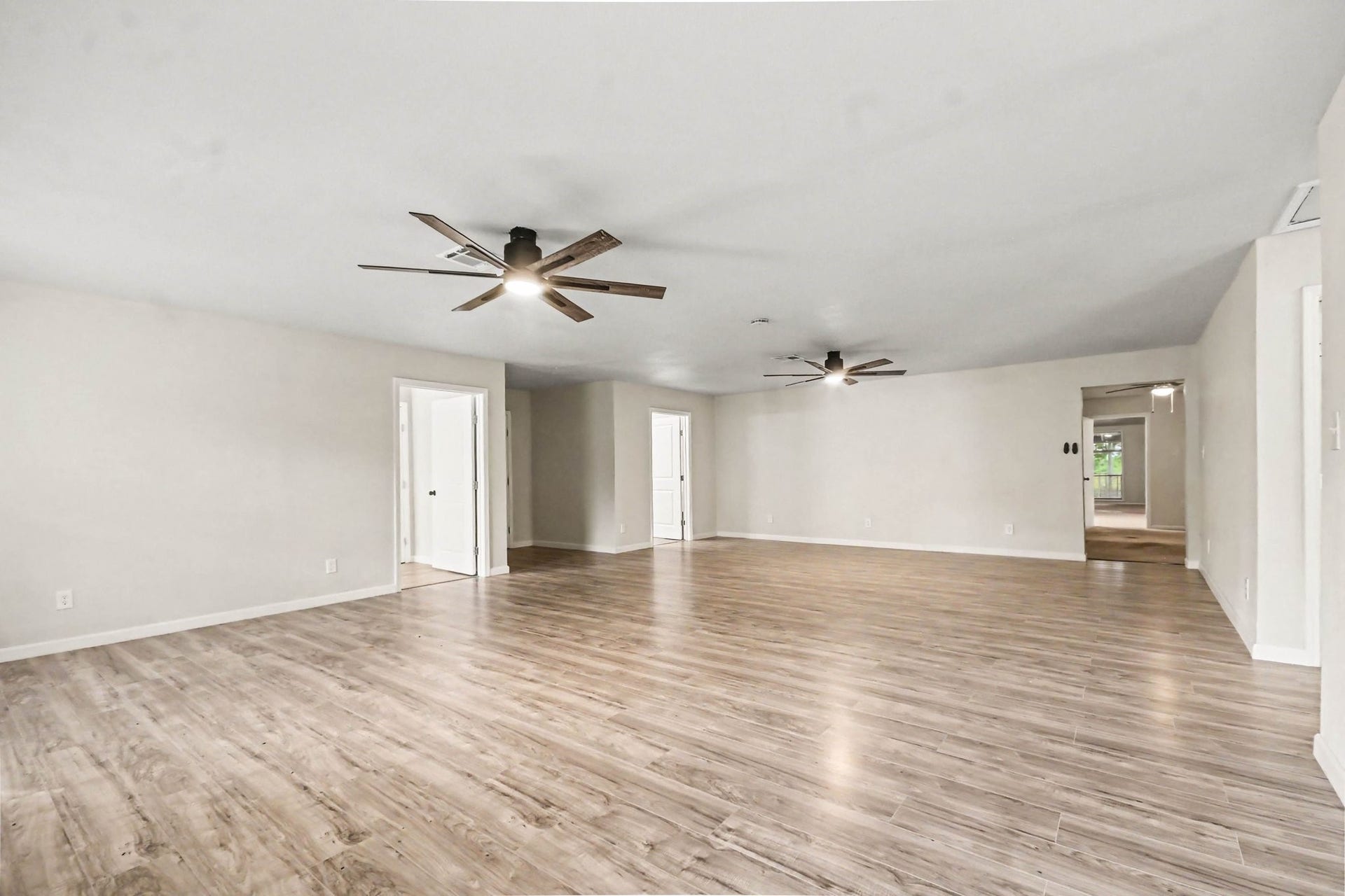 2925 FM 2917, Alvin, TX 77511 Giant game room has ceiling fan, new plank flooring, new paint
