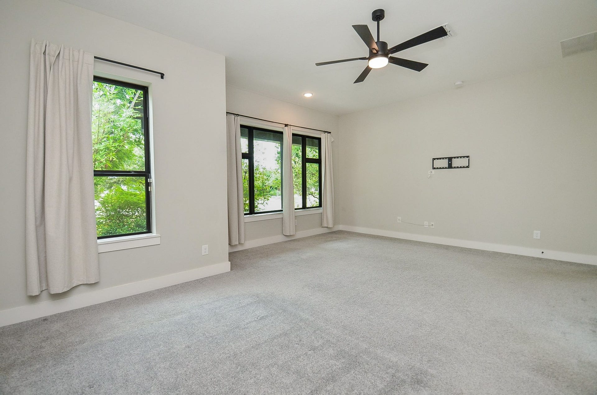 15814 Celebration Lane, Cypress, TX 77433 High ceilings and oversized windows enhance the primary suites airy, relaxing atmosphere.