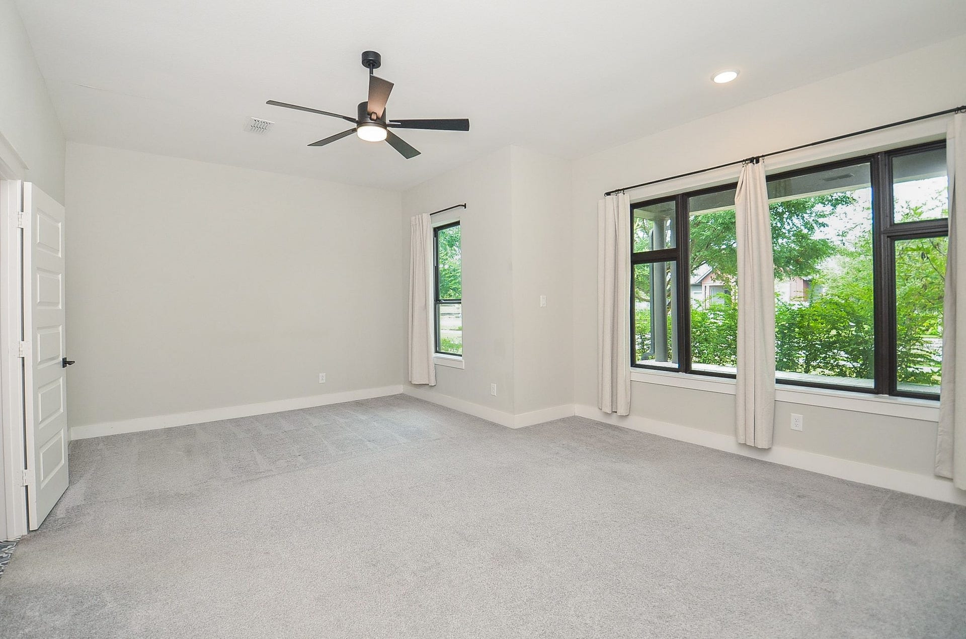 15814 Celebration Lane, Cypress, TX 77433 Serene primary retreat pairs generous proportions with large windows and calming neutral finishes.