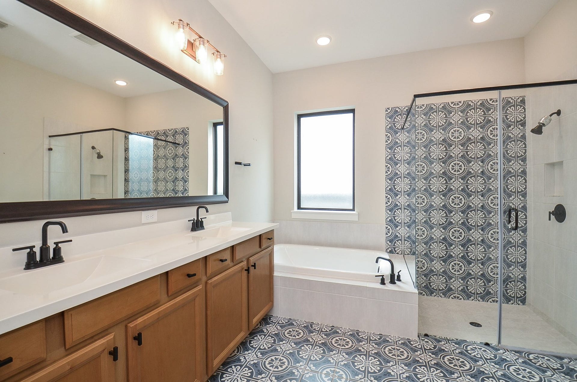 15814 Celebration Lane, Cypress, TX 77433 Primary bath offers an extended vanity, ample counter space and a clean, timeless aesthetic.