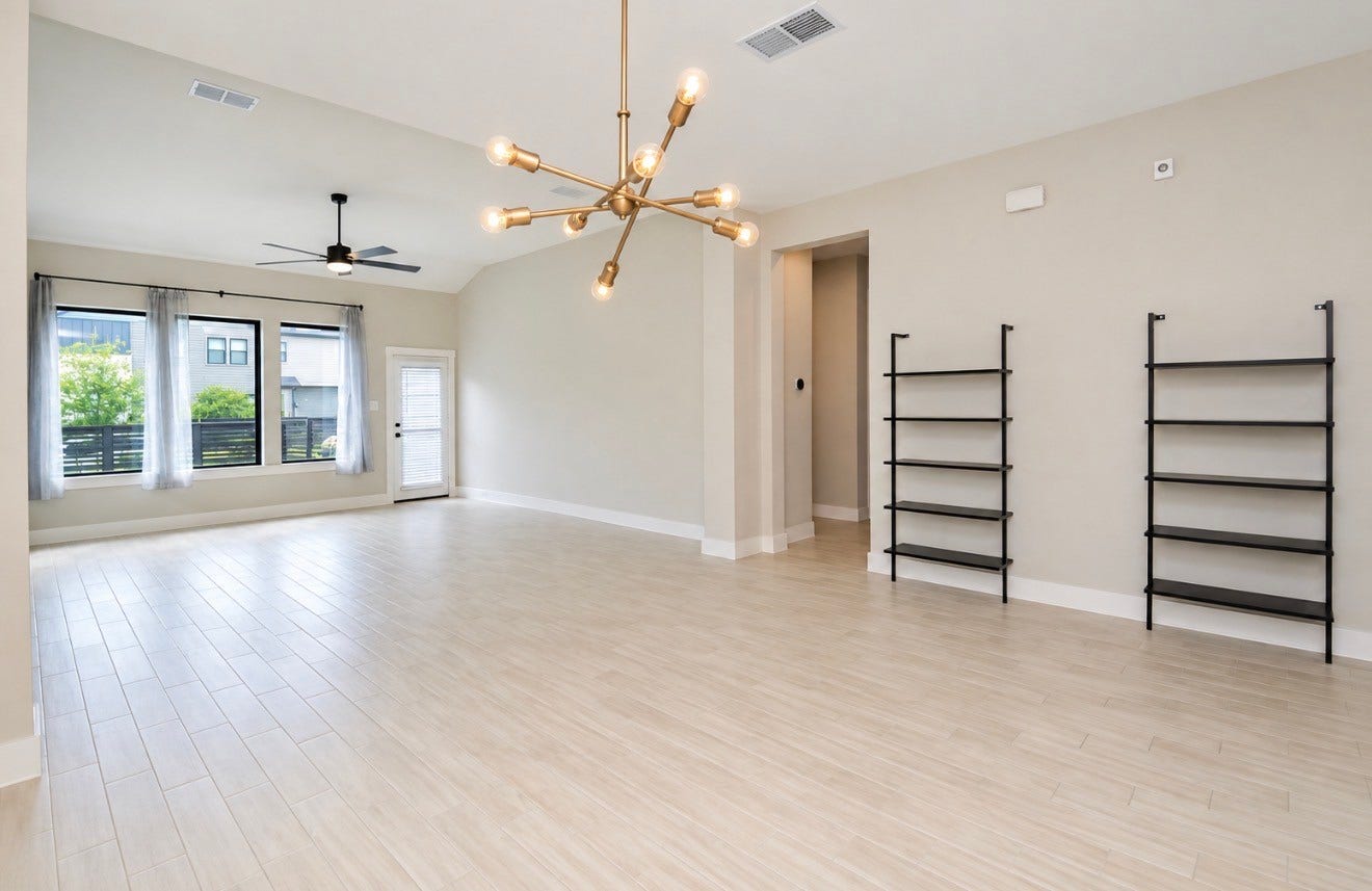 15814 Celebration Lane, Cypress, TX 77433 Spacious living area featuring abundant natural light and built-in shelving.