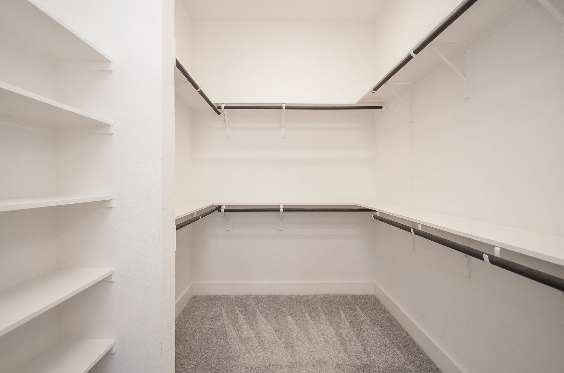 15814 Celebration Lane, Cypress, TX 77433 Walk-in wardrobe delivers organized storage with built-in shelving and abundant hanging space.