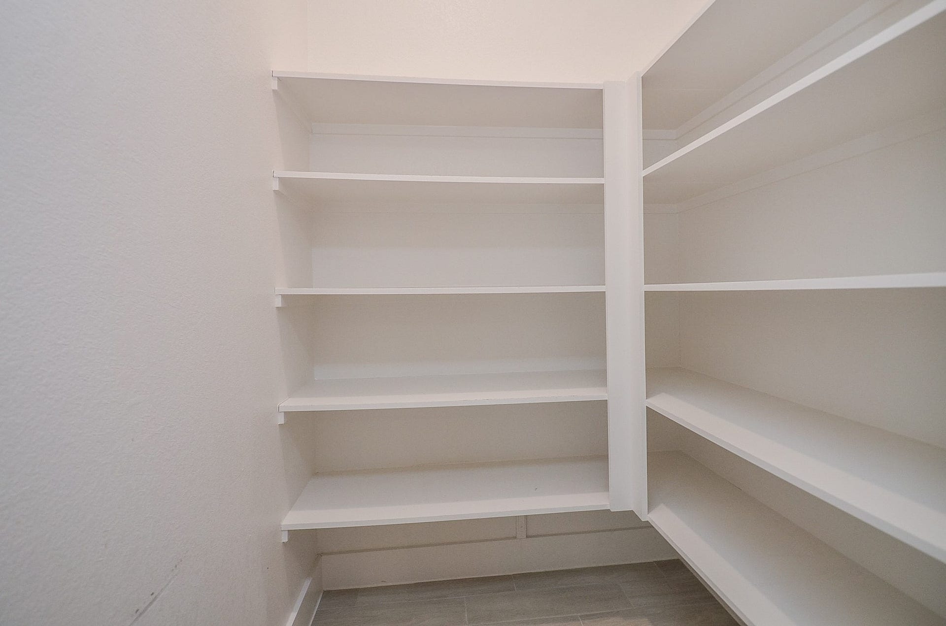15814 Celebration Lane, Cypress, TX 77433 Walk-in pantry provides generous shelving and convenient storage to keep kitchen essentials organized and within easy reach.